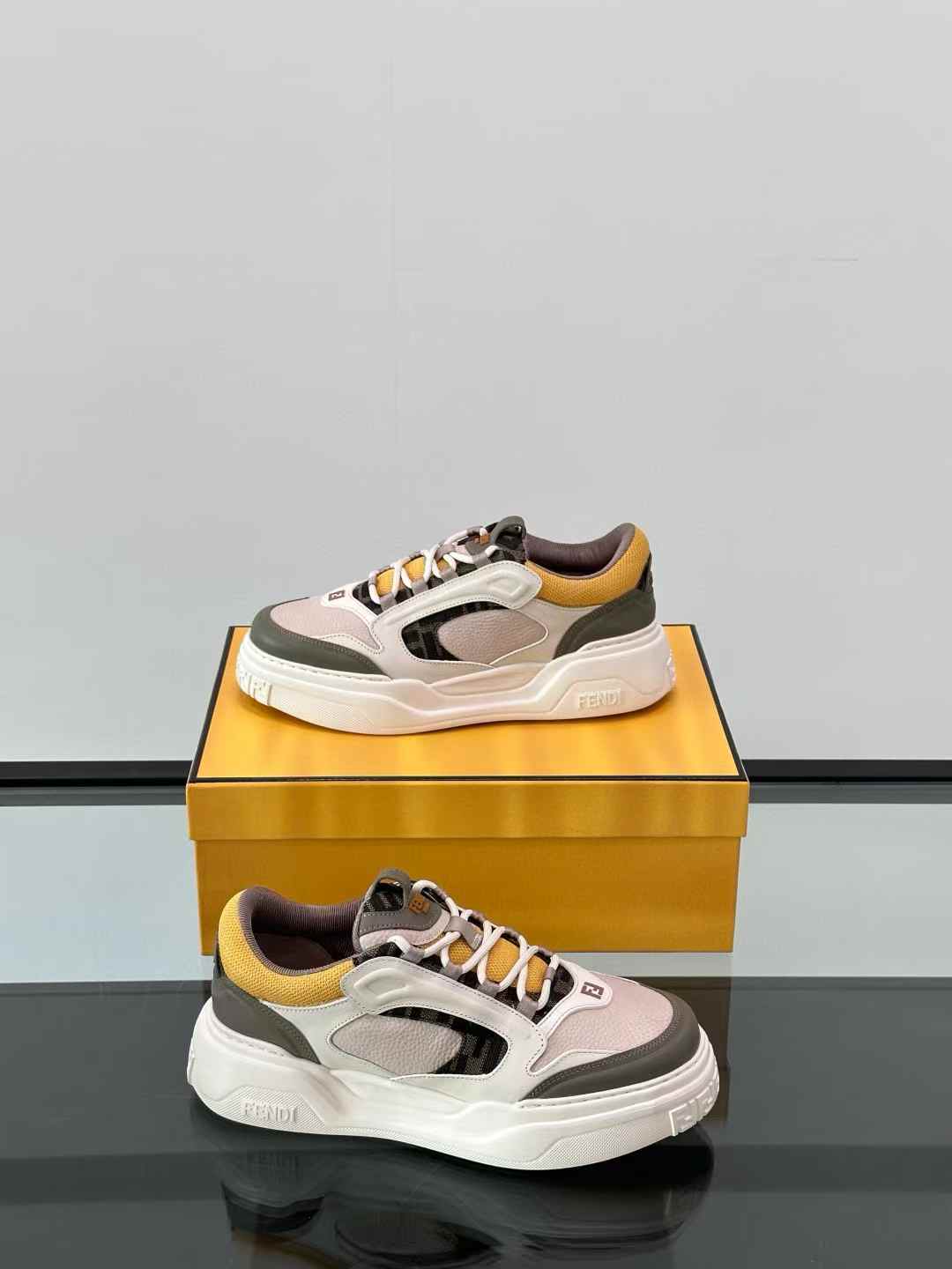 Fendi Force low-top sneakers in white, brown, and yellow leather with FF jacquard details