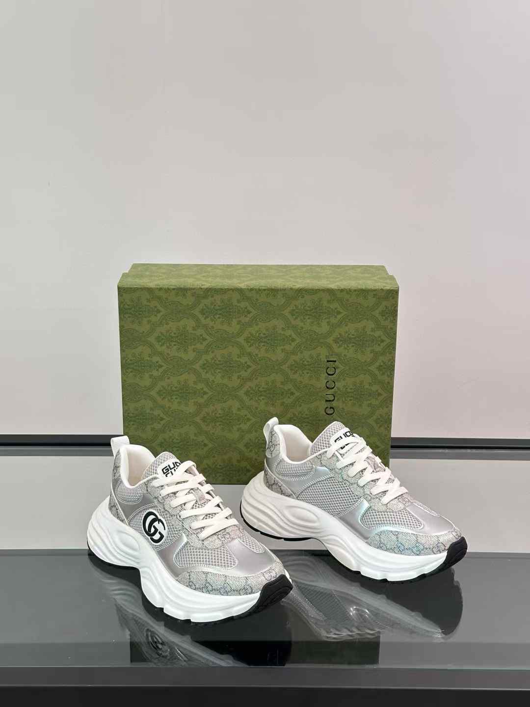Gucci sneakers with a silver-tone mesh upper and chunky white sole
