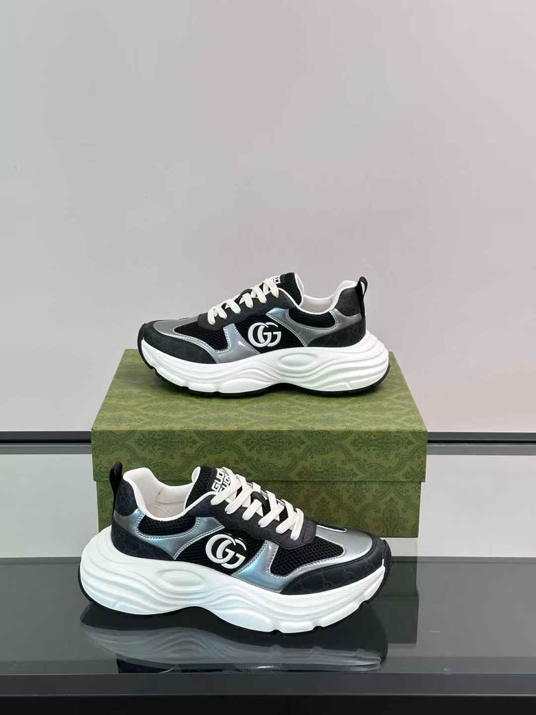 gucci black and silver-toned sneakers with a white chunky sole