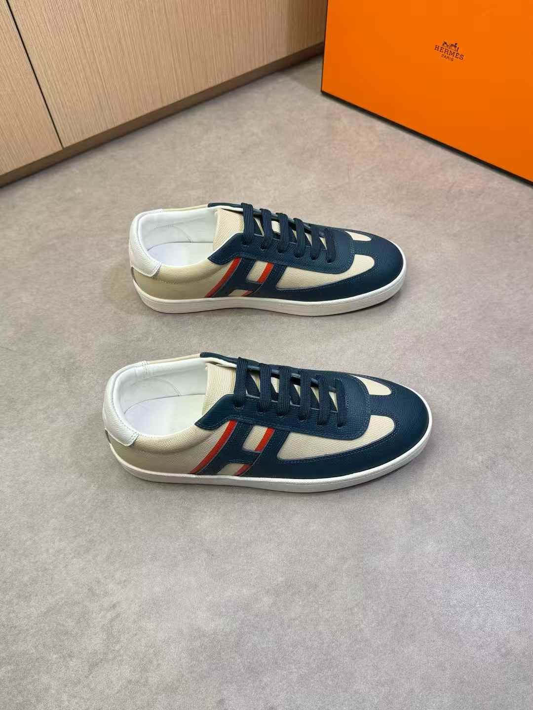 Hermès Boomerang sneakers in Epsom and printed calfskin with an orange sole accent