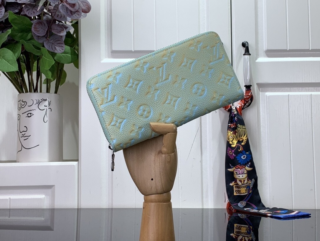 LV Zippy Wallet in light blue Monogram Empreinte leather from the Summer Stardust collection.