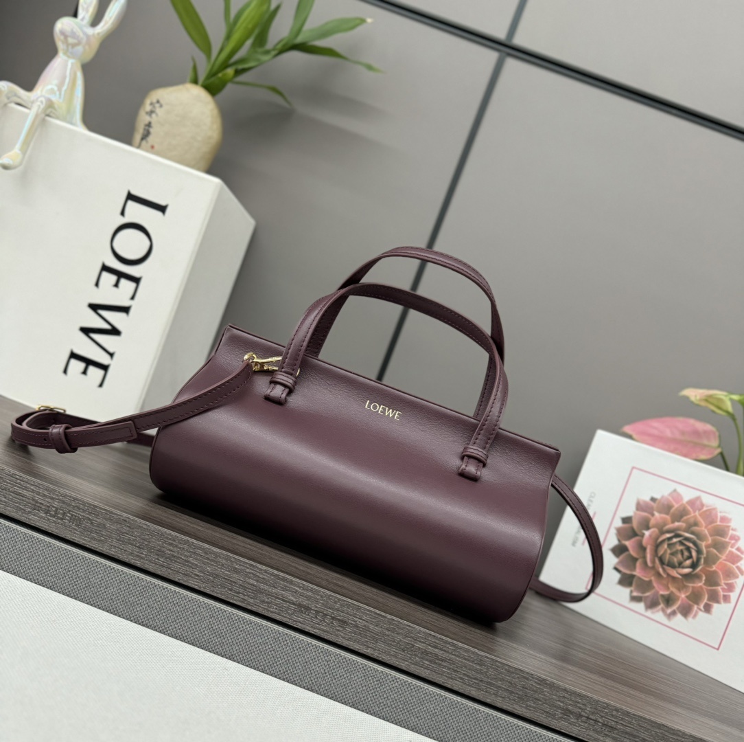 Loewe cylindrical leather handbag in a deep plum color