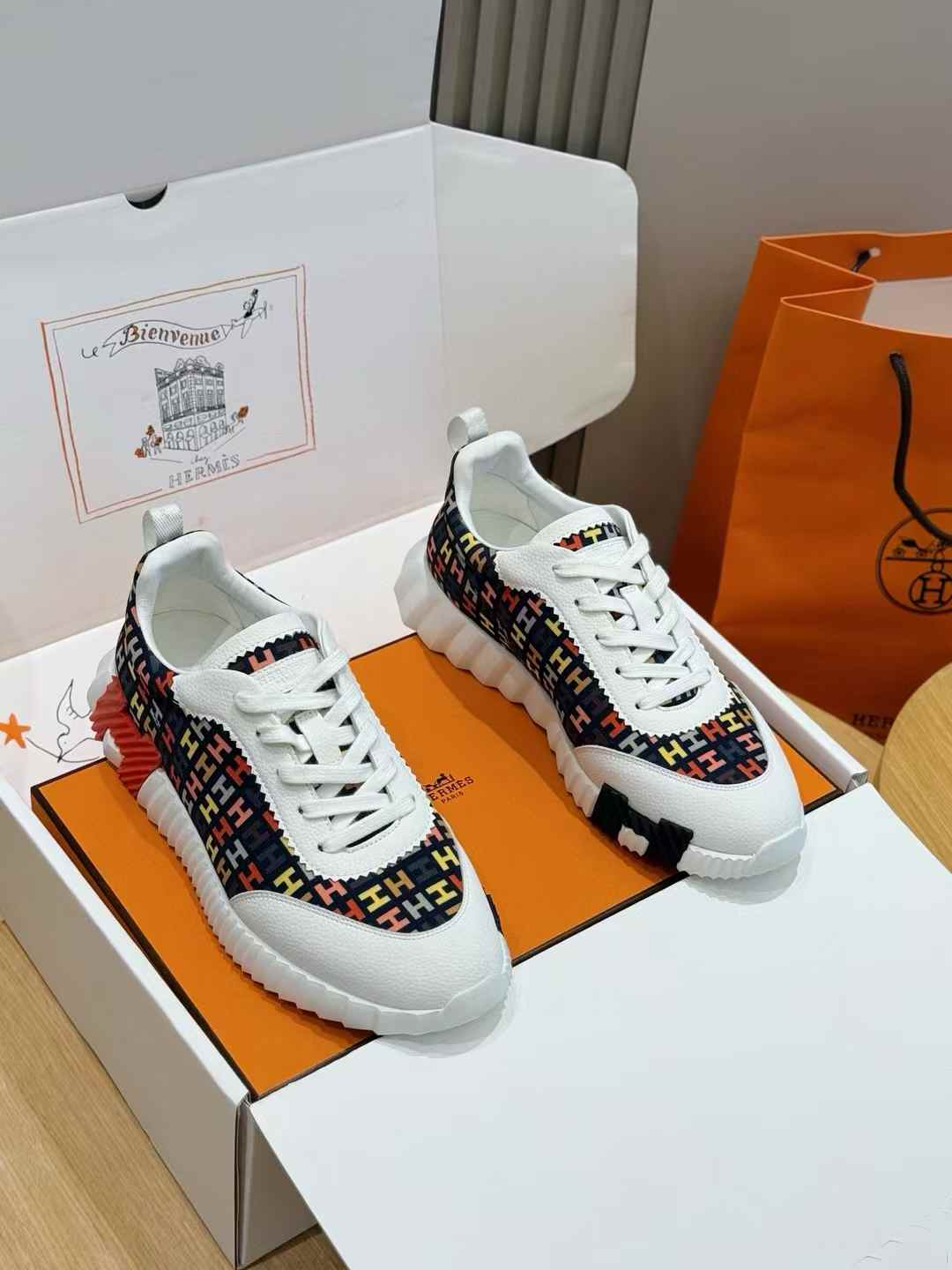Hermès Bouncing sneaker with a multicolored signature pattern and white rubber sole