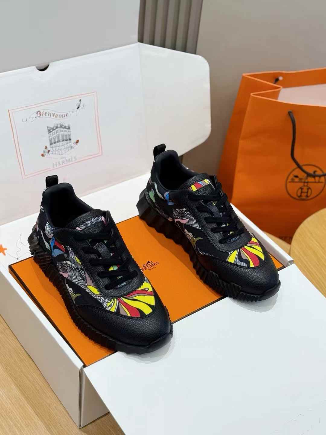 black printed design sneakers with a colorful graphic pattern