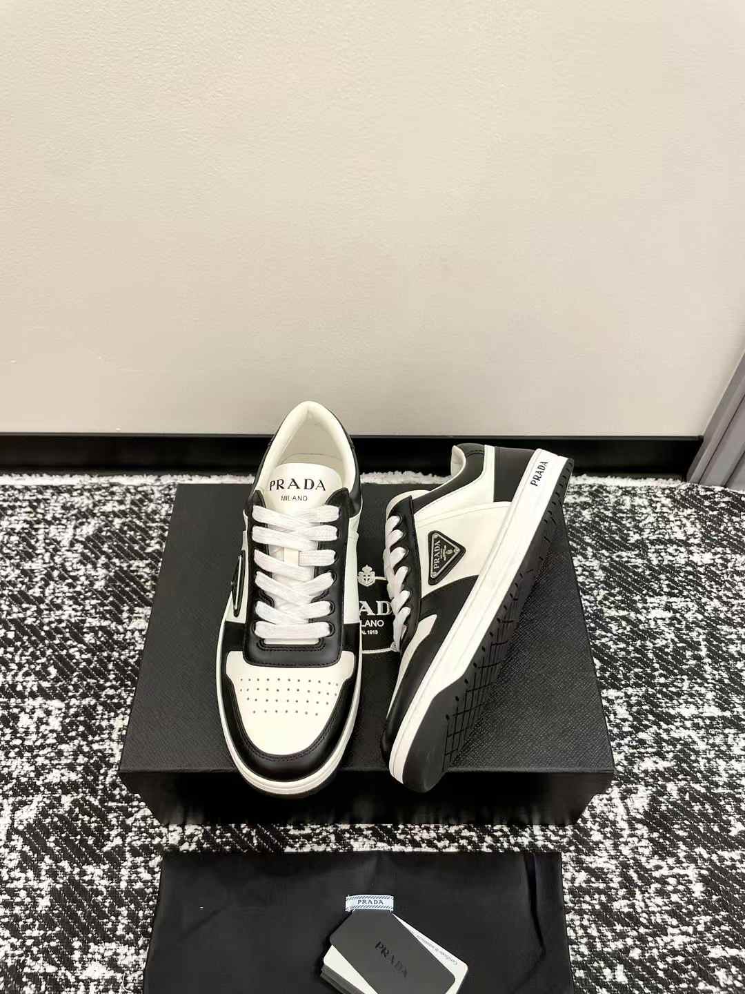 Prada Downtown low-top sneaker in white and black leather
