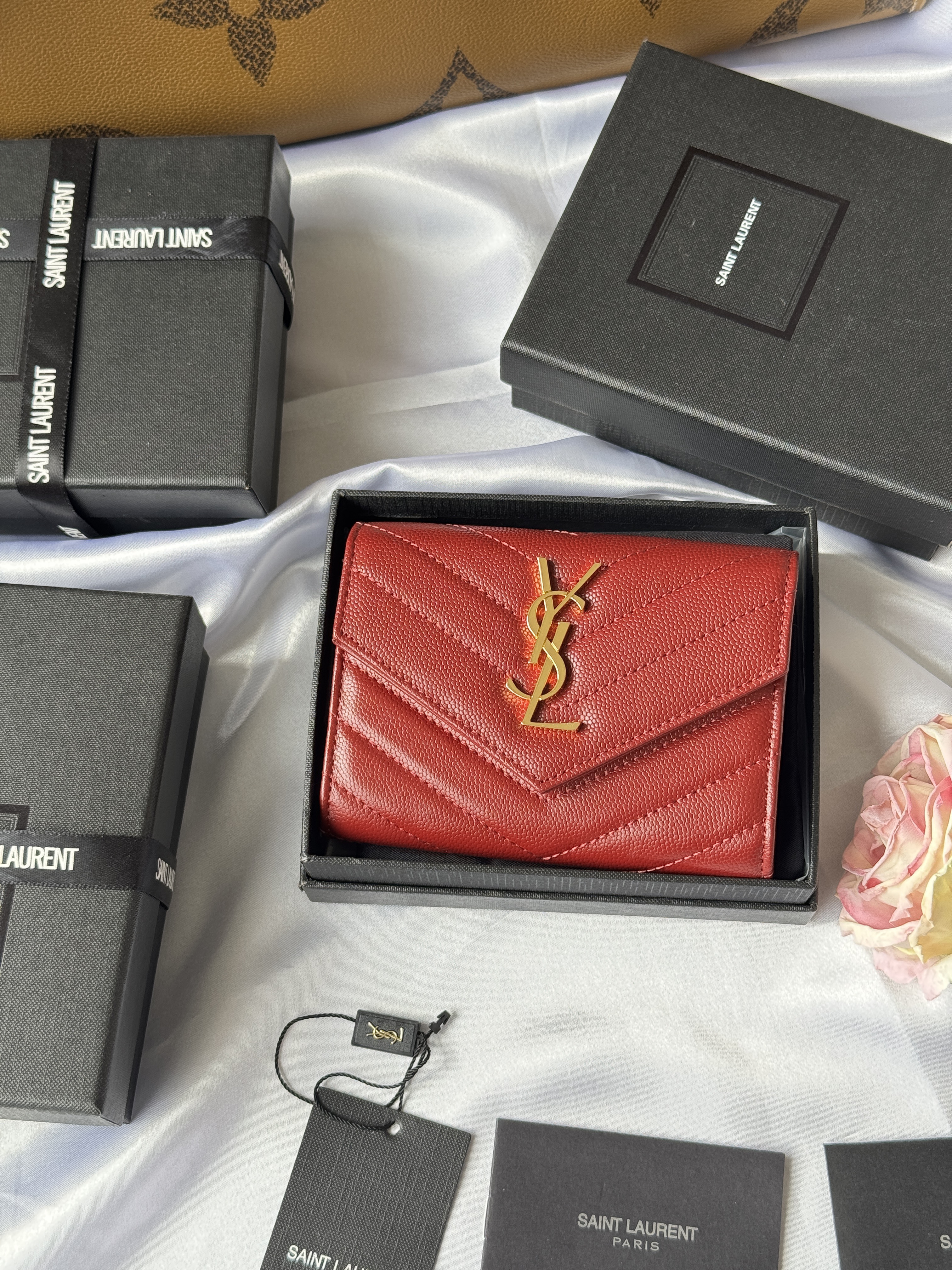YSL Cassandre Matelassé compact tri-fold wallet in red leather with gold-tone hardware