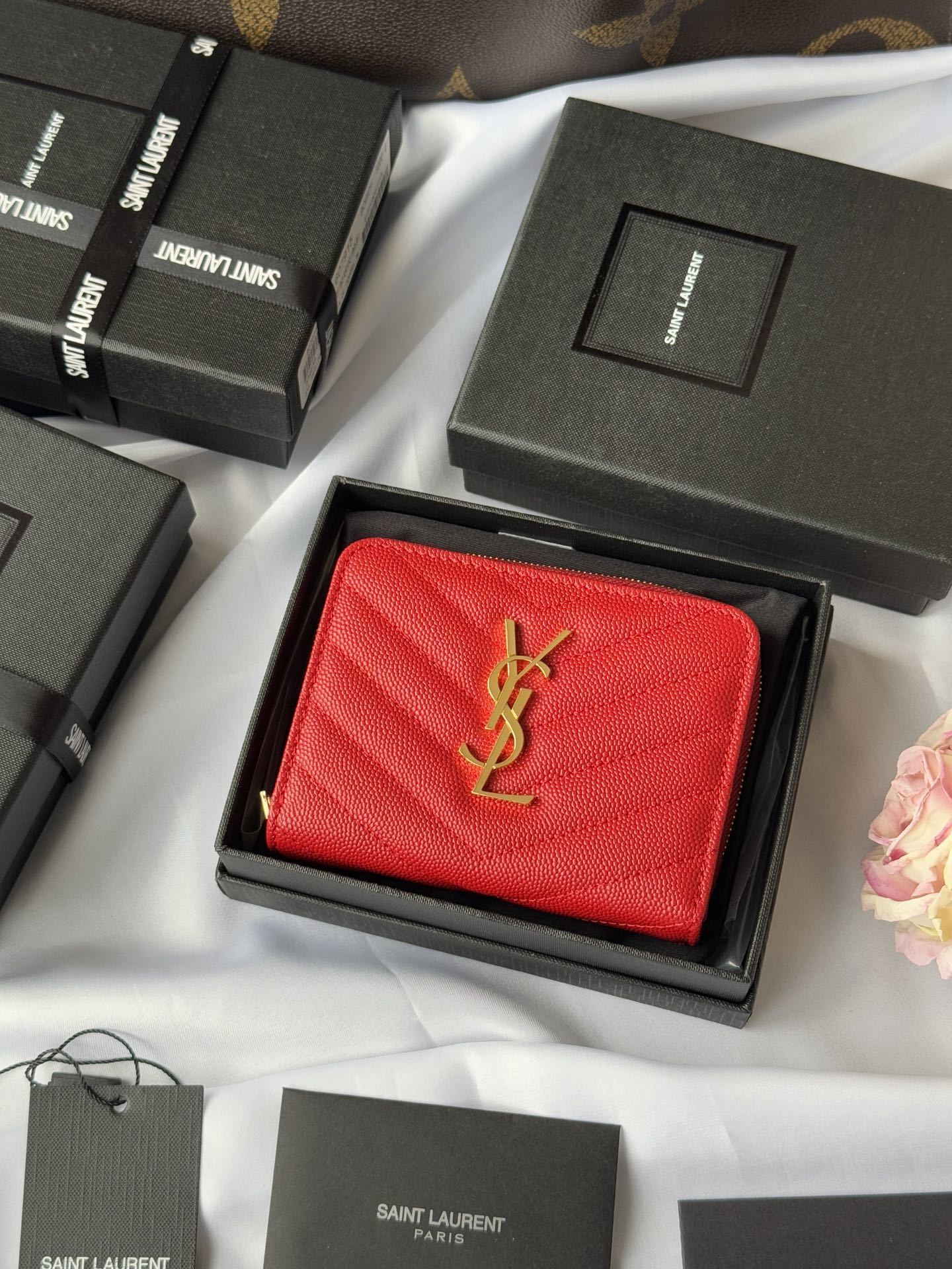 YSL V-stitch bifold wallet in calfskin leather.