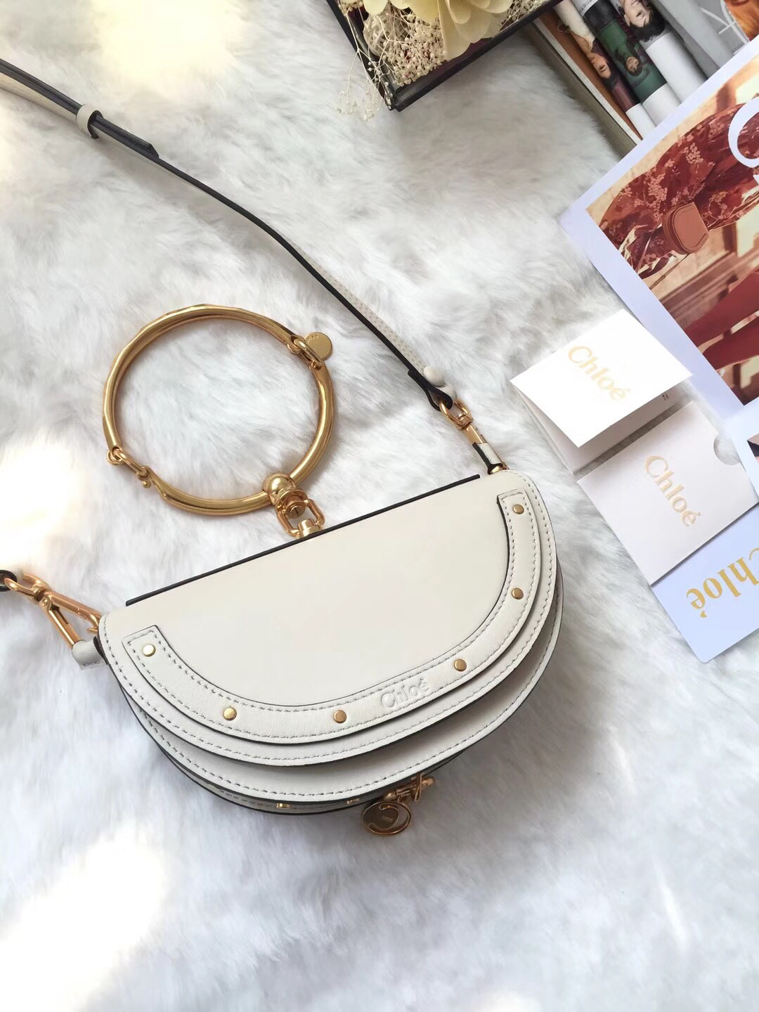 Chloe small Nile bracelet minaudiere bag in off-white or beige leather.