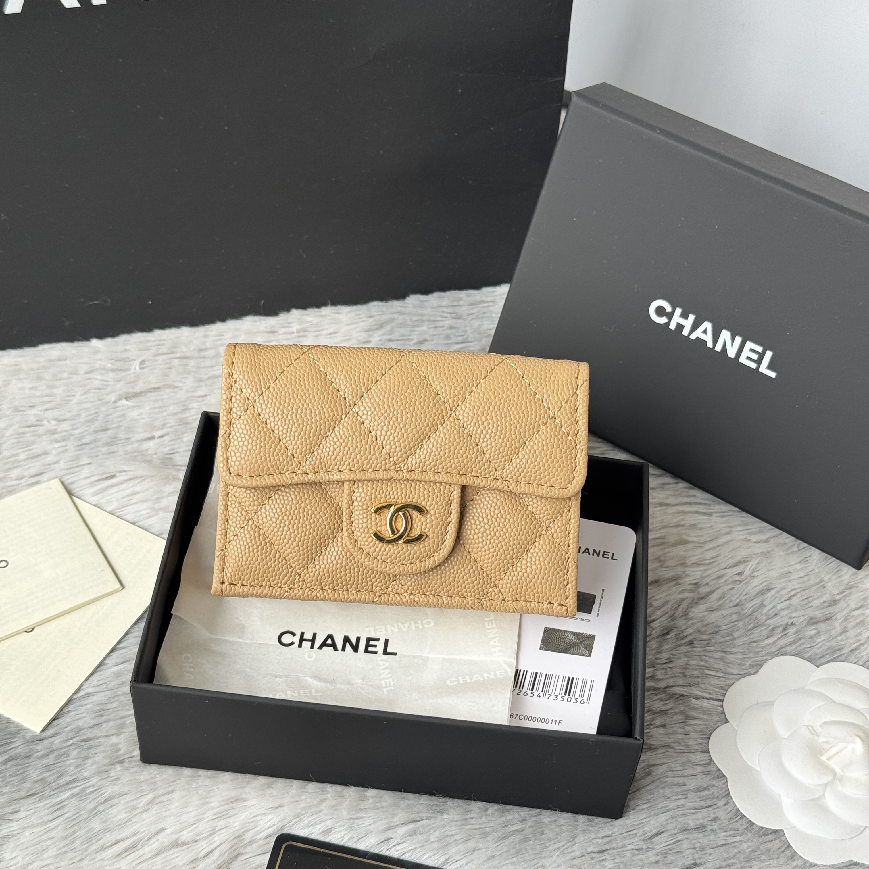 Chanel Flap Card Holder in a beige caviar quilted leather