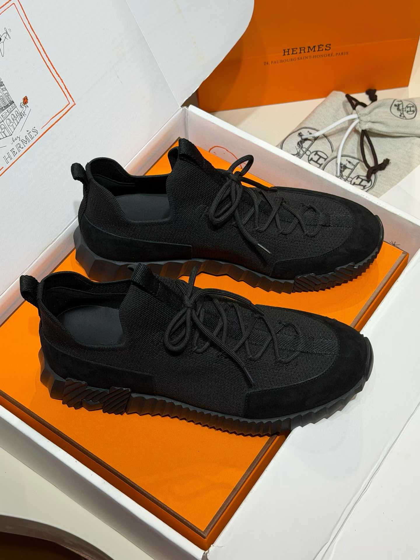 Hermès Lift slip-on sneaker in black knit and suede goatskin with a rubber sole