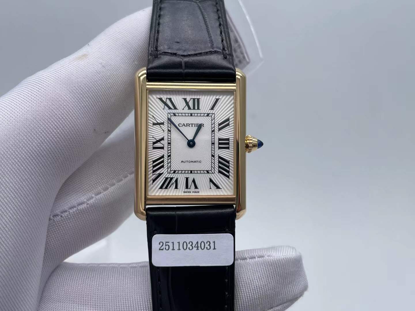 Cartier Tank Louis Cartier watch in yellow gold with a black alligator-skin strap.