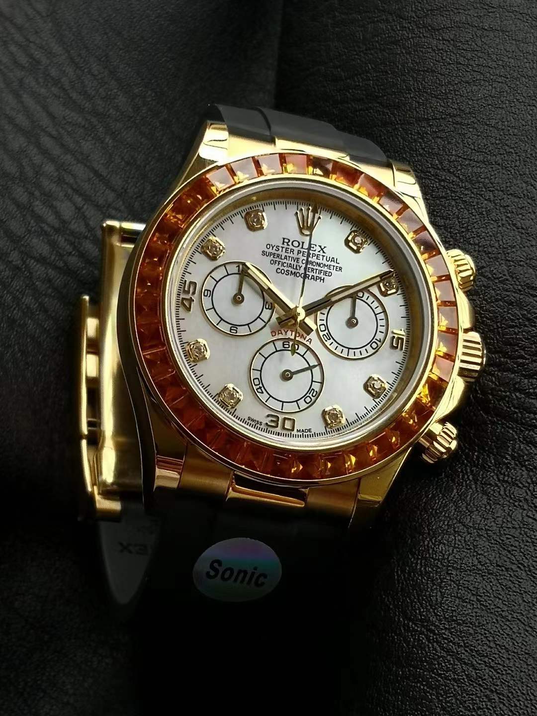 Rolex Daytona 'Orange Sapphire Bezel M.O.P. Diamond Dial' with reference number 116578SACO