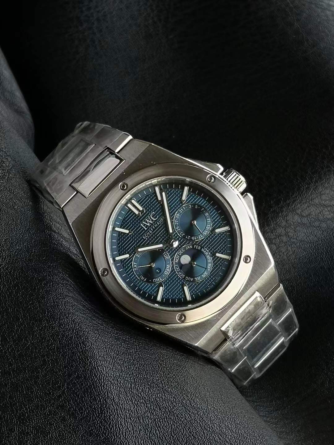 IWC Schaffhausen Ingenieur Automatic 40 watch with a blue dial and stainless steel case and integrated H-link bracelet.