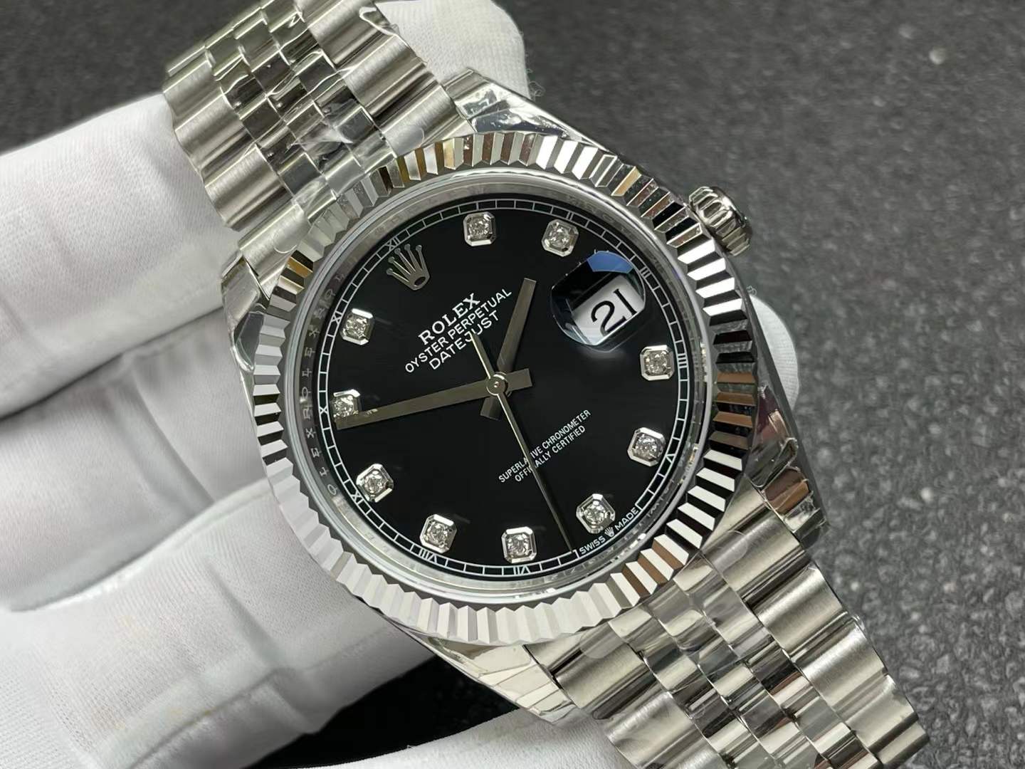 Rolex Oyster Perpetual Datejust watch with a black diamond dial