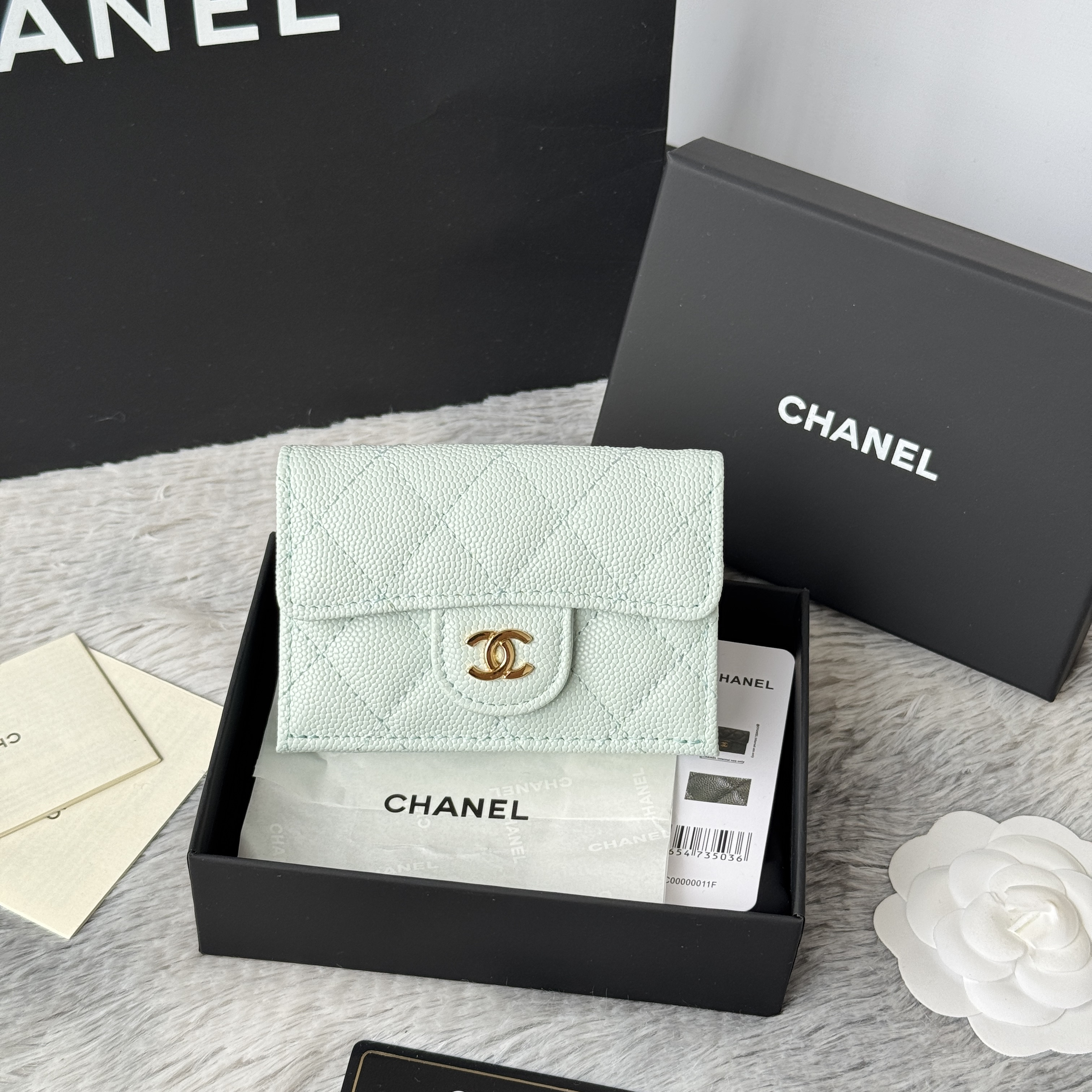 Chanel Classic small flap wallet in light green quilted caviar leather