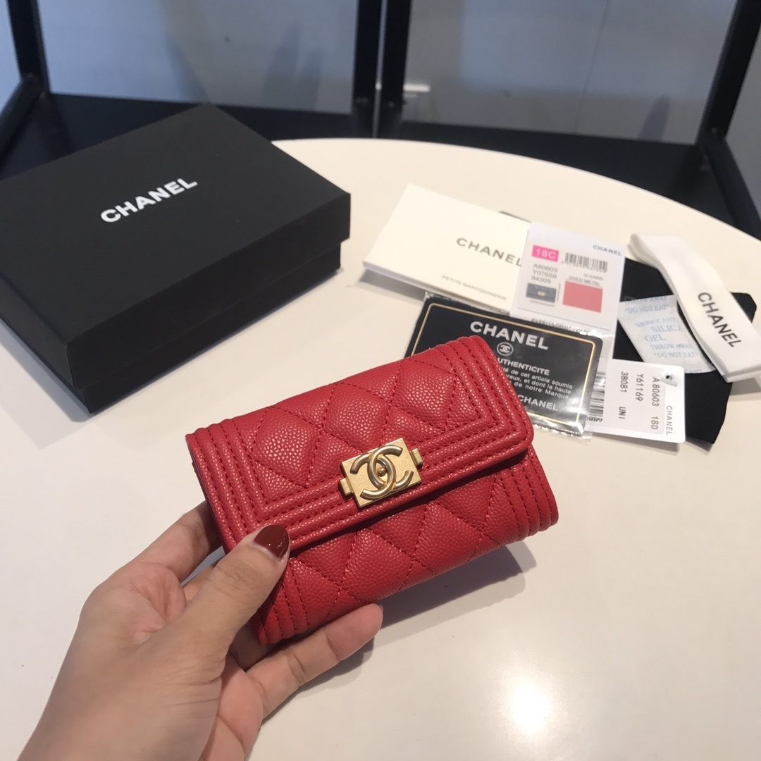 Chanel Boy compact wallet.