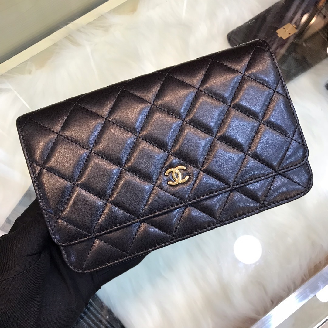 Chanel Classic Wallet on Chain (WOC) in black caviar or lambskin leather