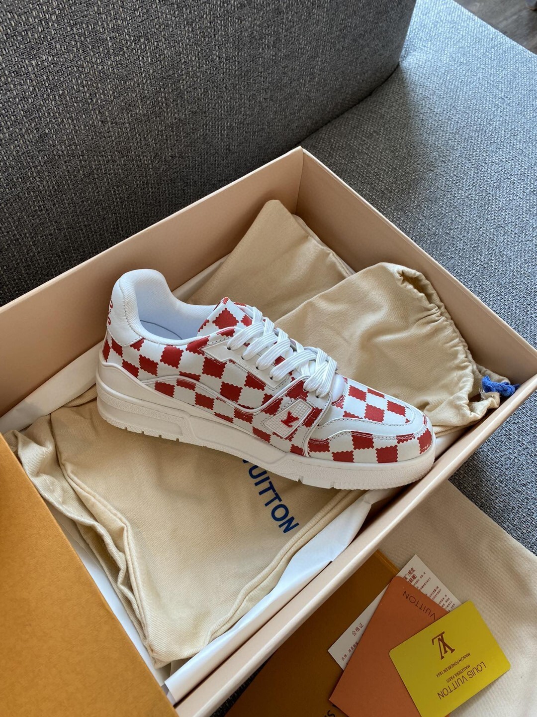 LV Nigo x Trainer sneaker in the red and white Damier pattern