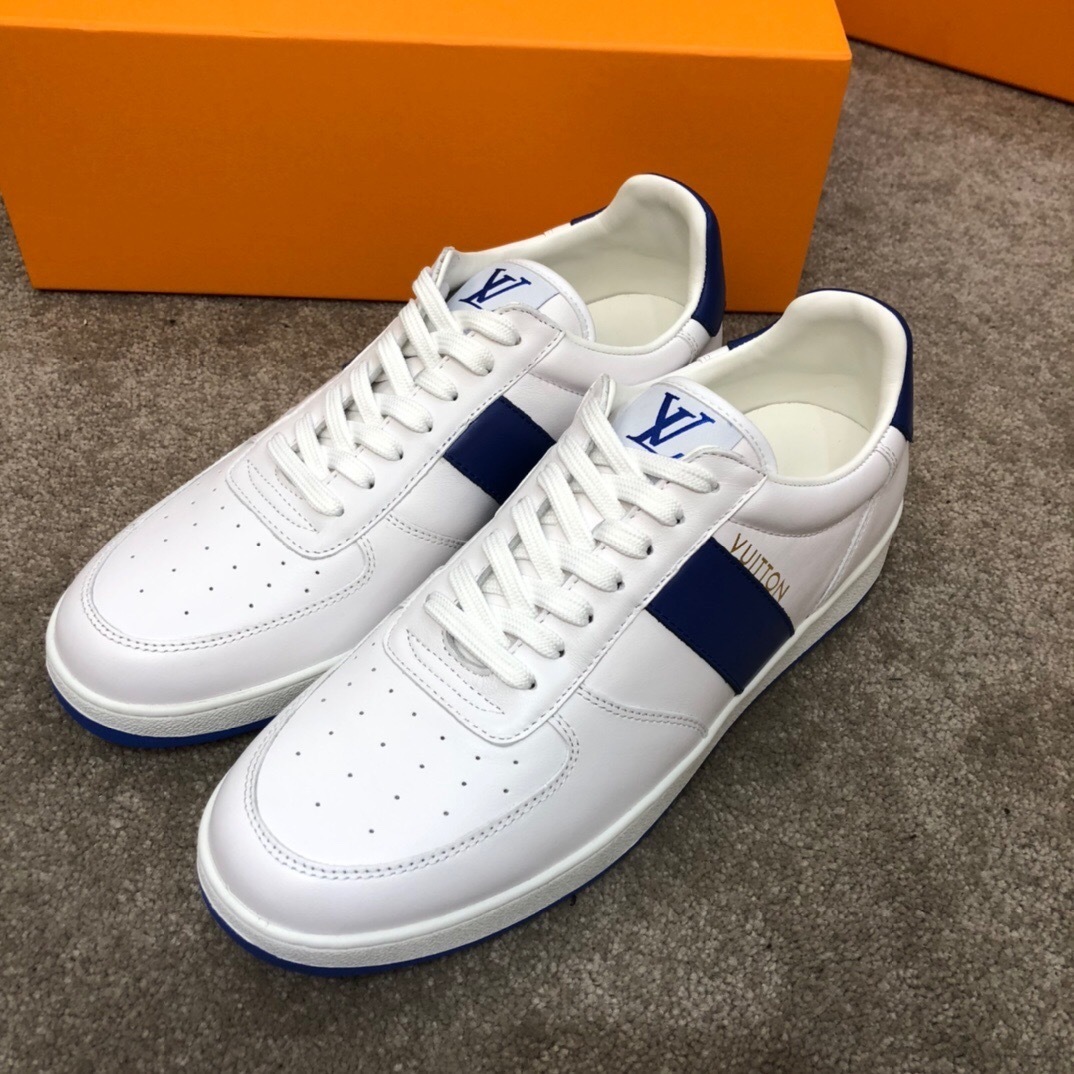 LV Trainer sneaker in white grained calf leather with blue accents