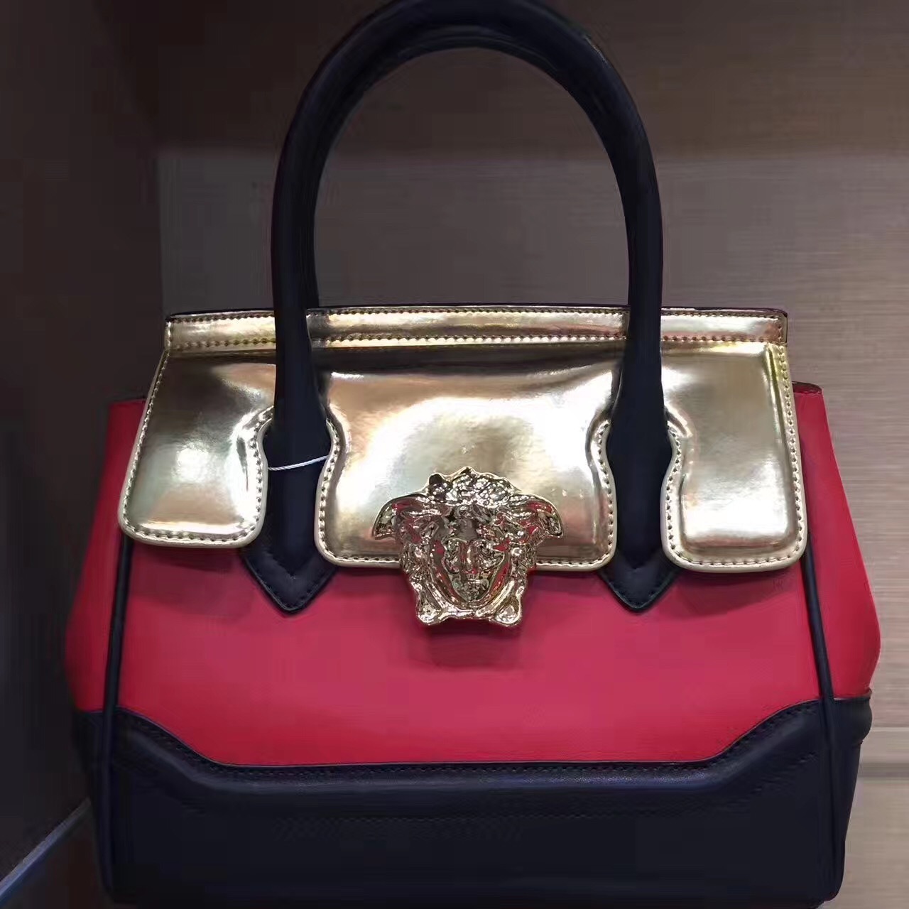 Versace Metallic Grained Calfskin Medium Palazzo Empire Bag in gold, red, and black