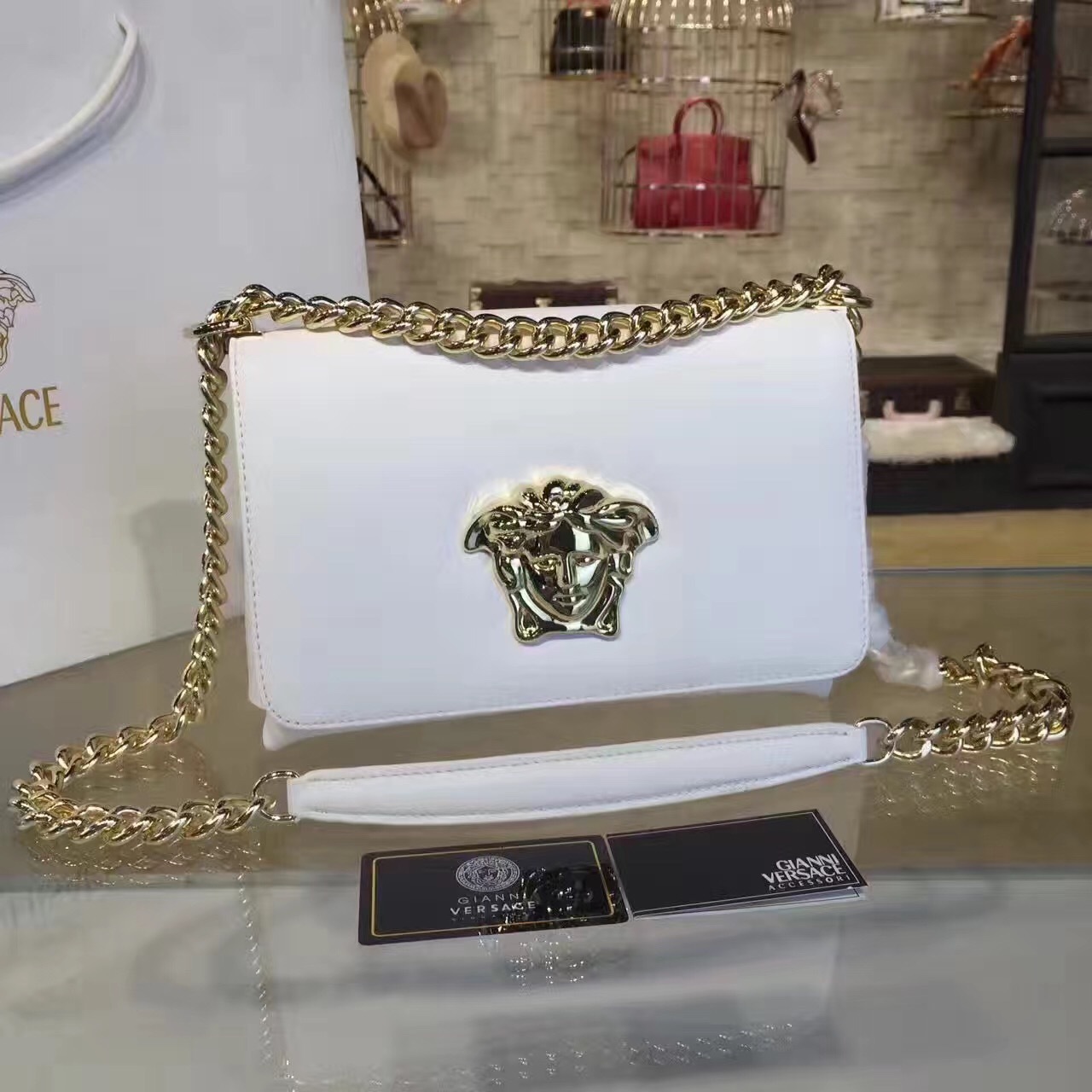 Versace Palazzo Sultan shoulder bag in white leather with gold-tone chain hardware
