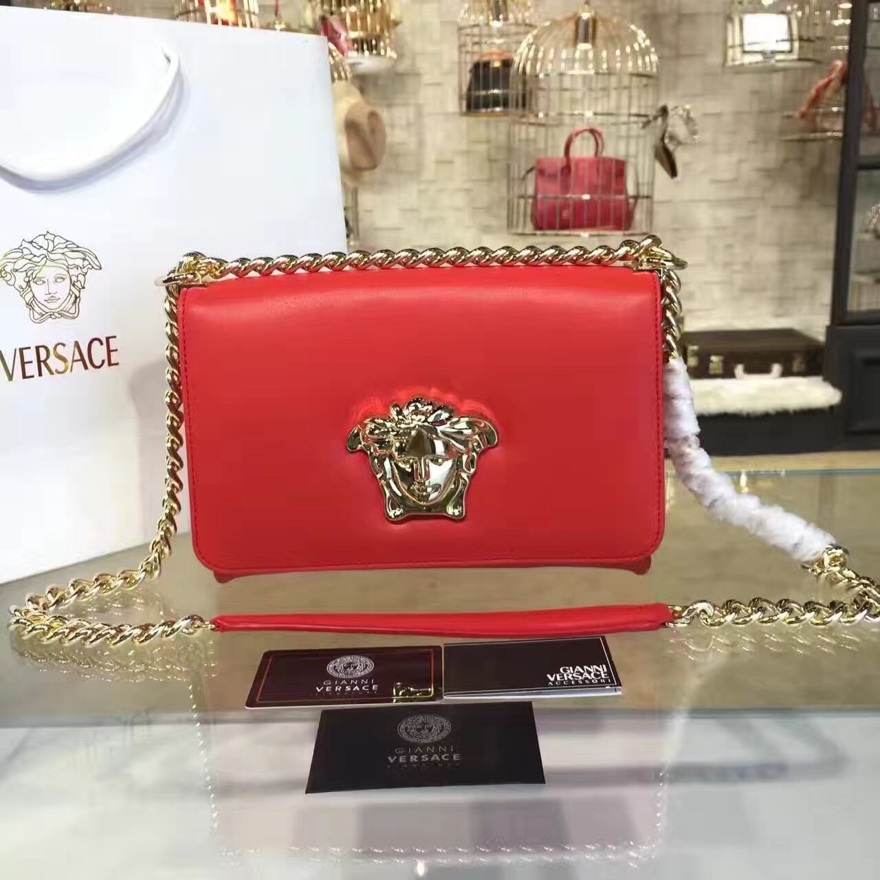 Versace Patent Leather Palazzo Medusa Chain Evening Bag with a gold-tone Medusa logo and chain strap