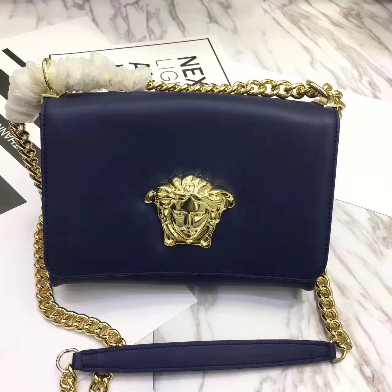 Versace La Medusa crossbody bag in a navy blue leather with gold-tone hardware