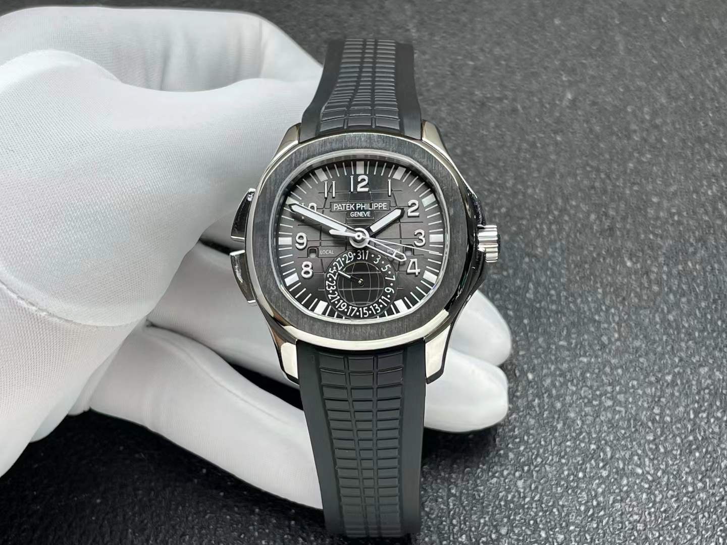 Patek Philippe Aquanaut Travel Time 5164A-001 in stainless steel with a black dial and integrated black composite strap