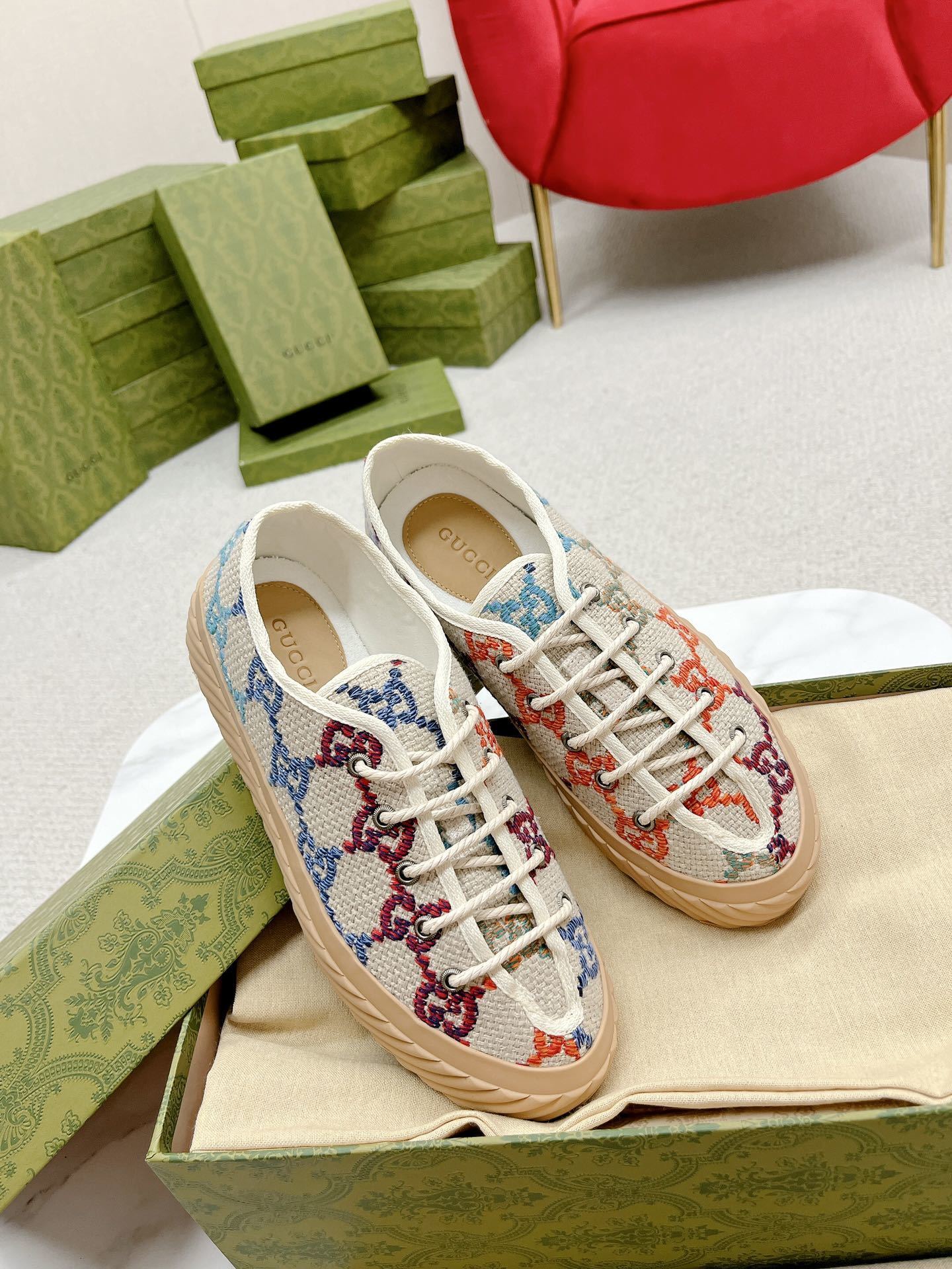 Gucci lace-up sneakers with a colorful interlocking G monogram pattern