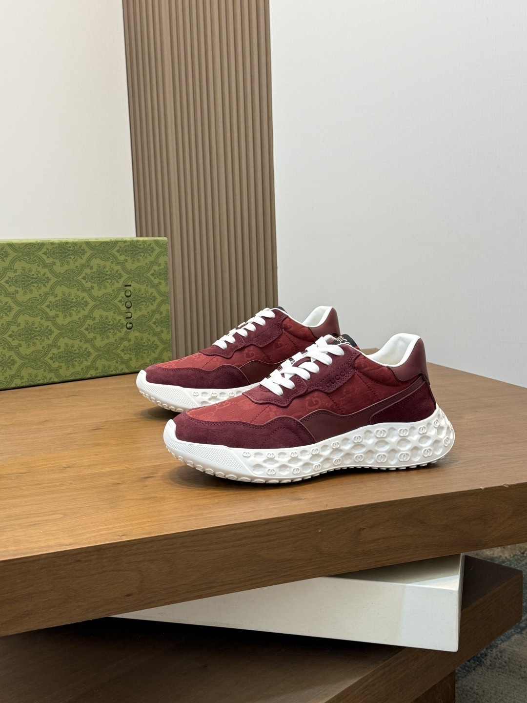 Gucci burgundy sneakers with a distinctive textured white sole