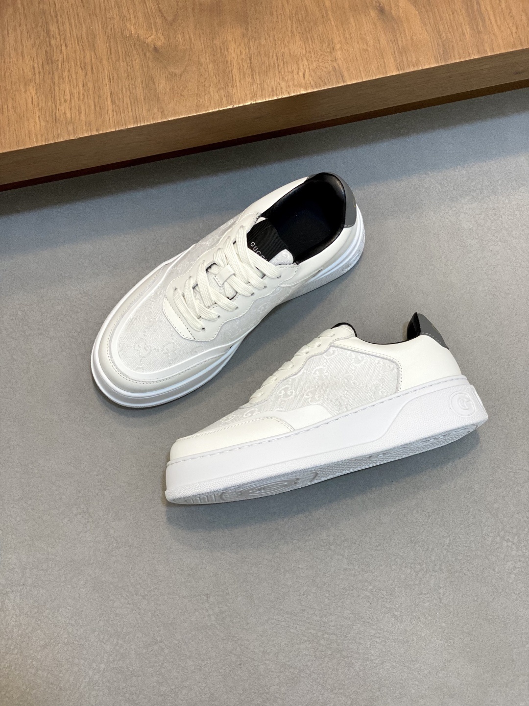 Gucci white leather sneakers.