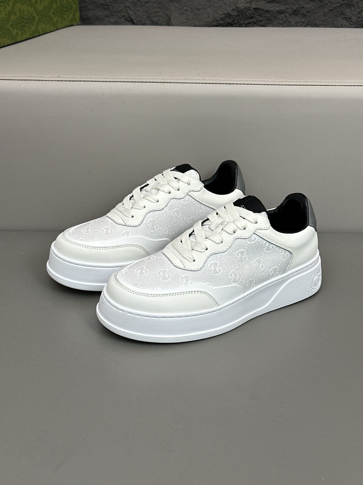 Gucci GG Embossed Low-Top Sneakers in white leather