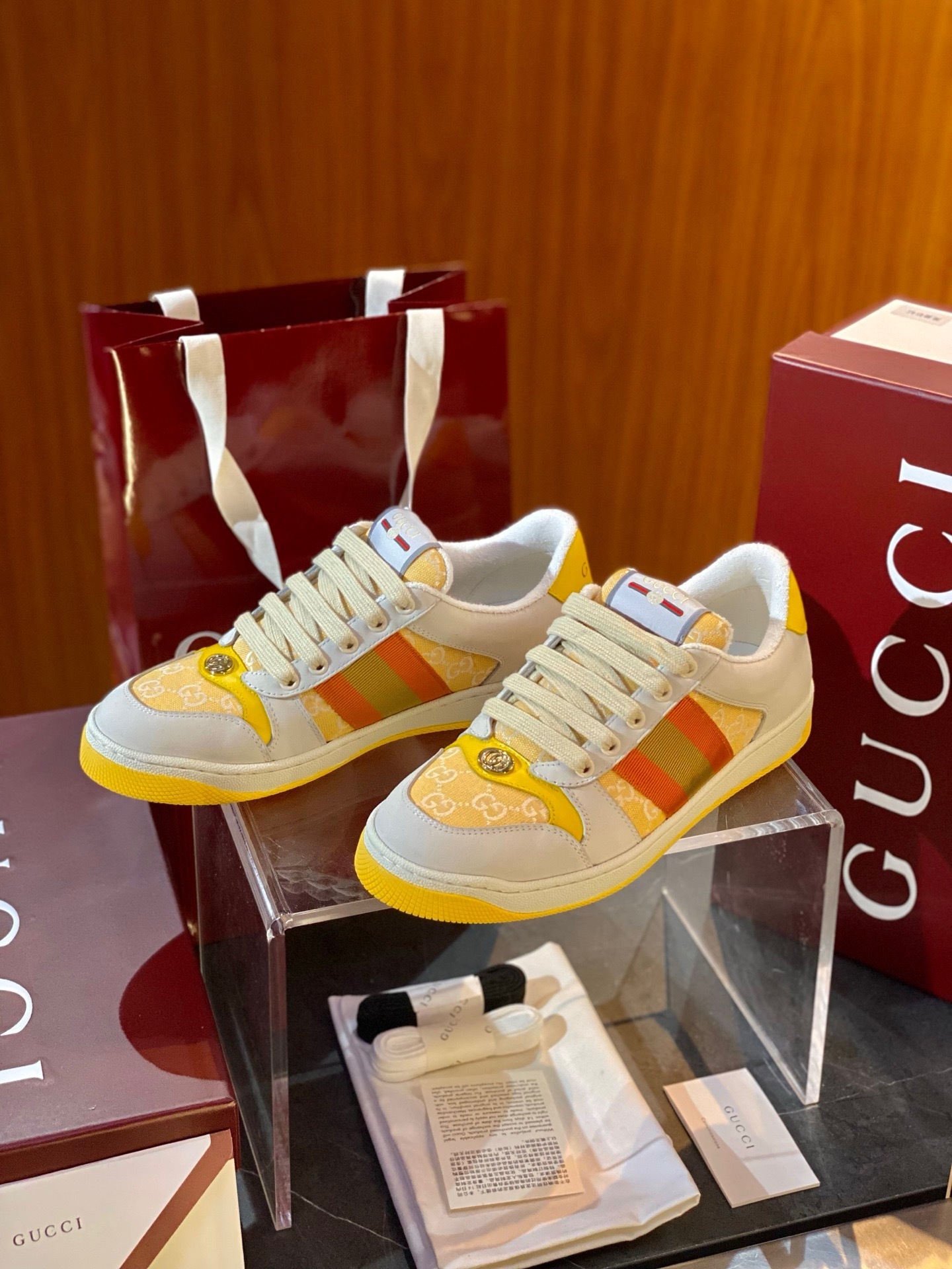 Gucci women's Screener sneakers in beige and pink with yellow and orange stripes