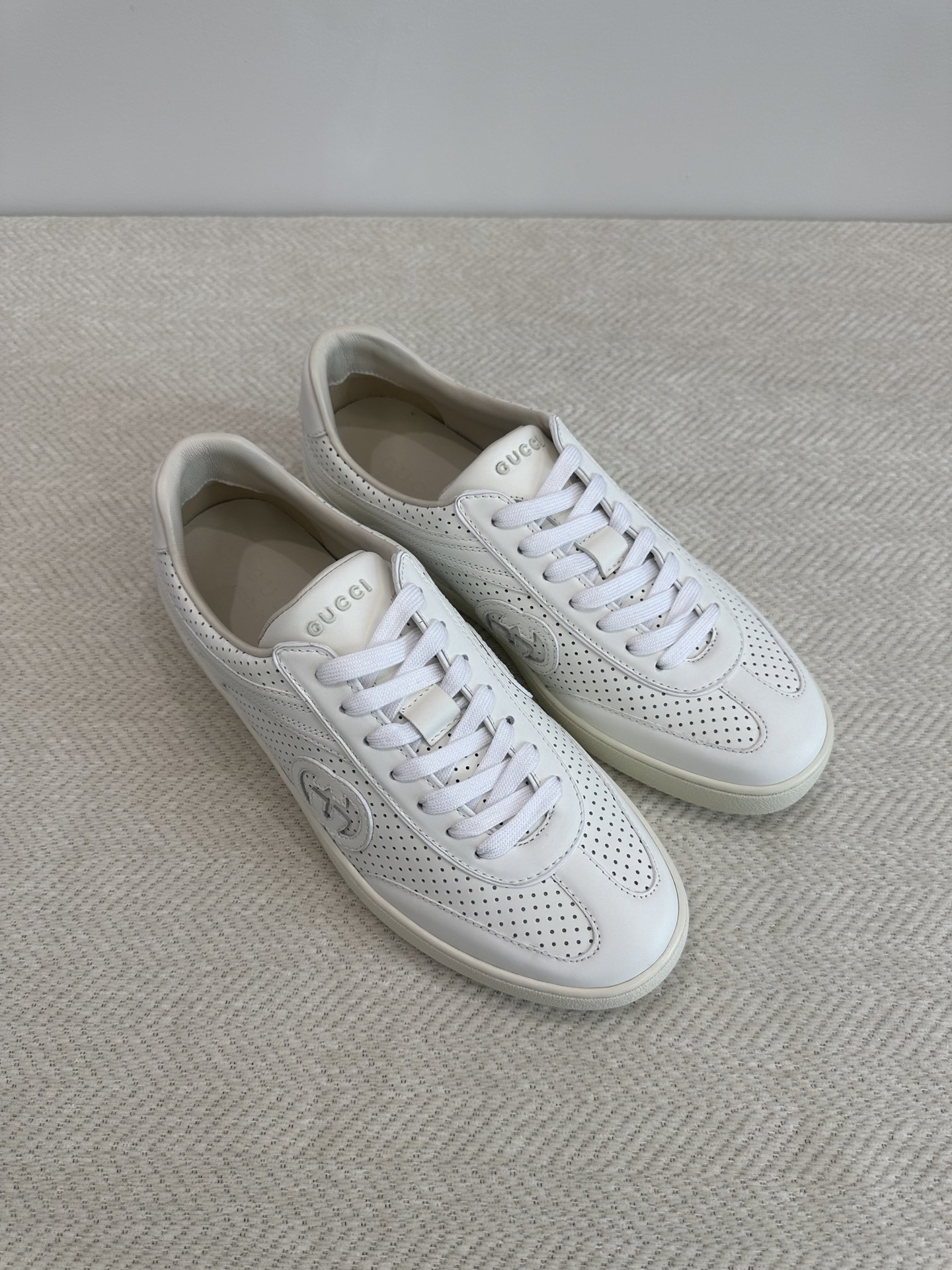 Gucci G75 Interlocking G low-top sneakers in white perforated leather