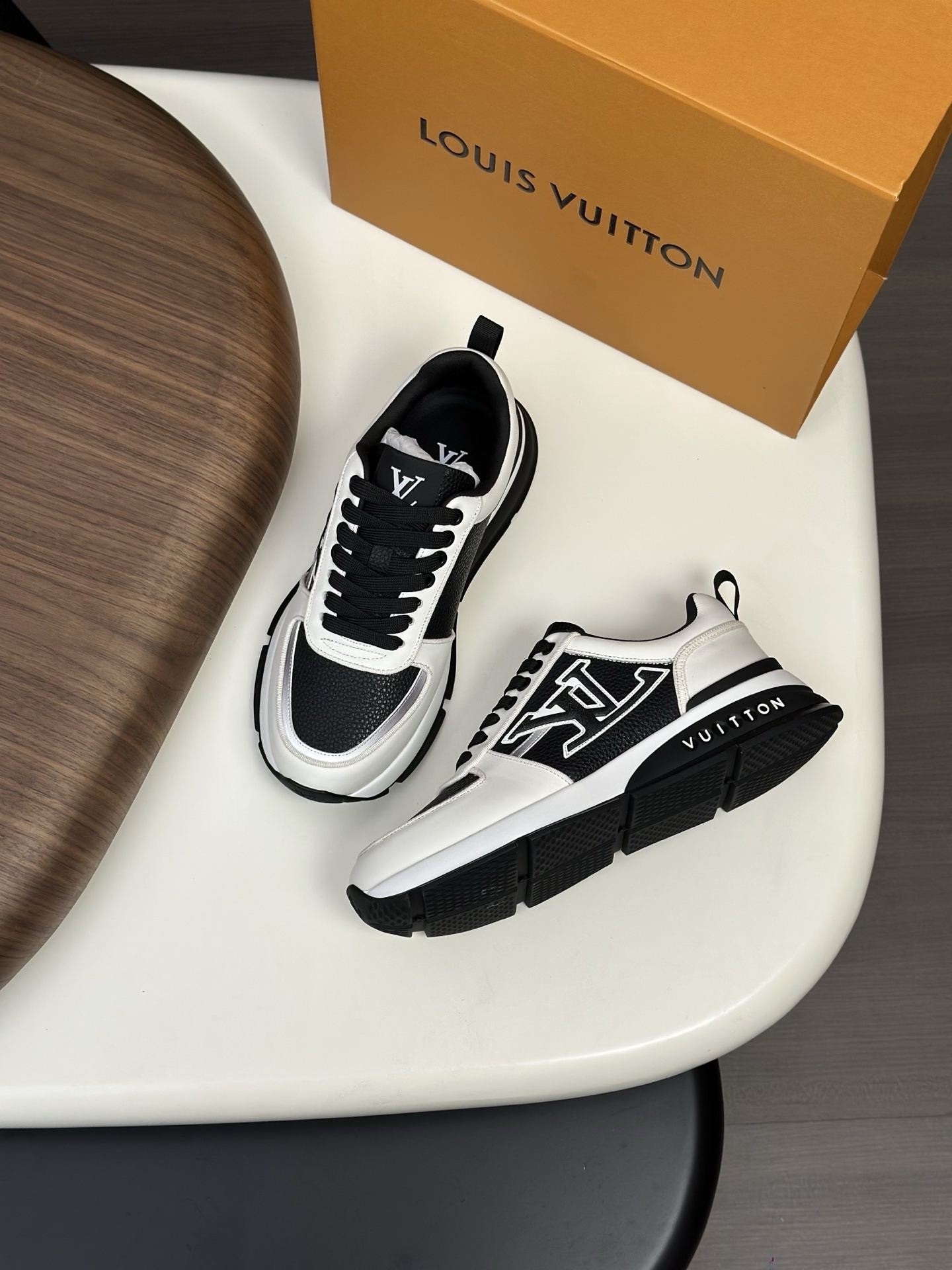 LV Trainer sneaker in a black and white colorway calfskin leather