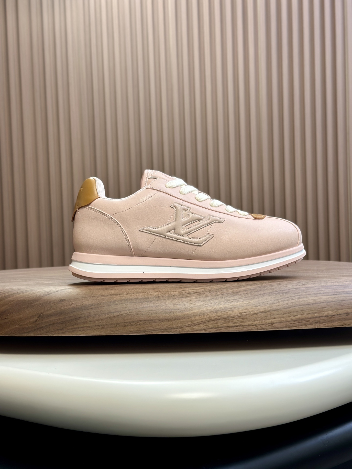 LV Buttersoft Sneaker in a beige colorway.
