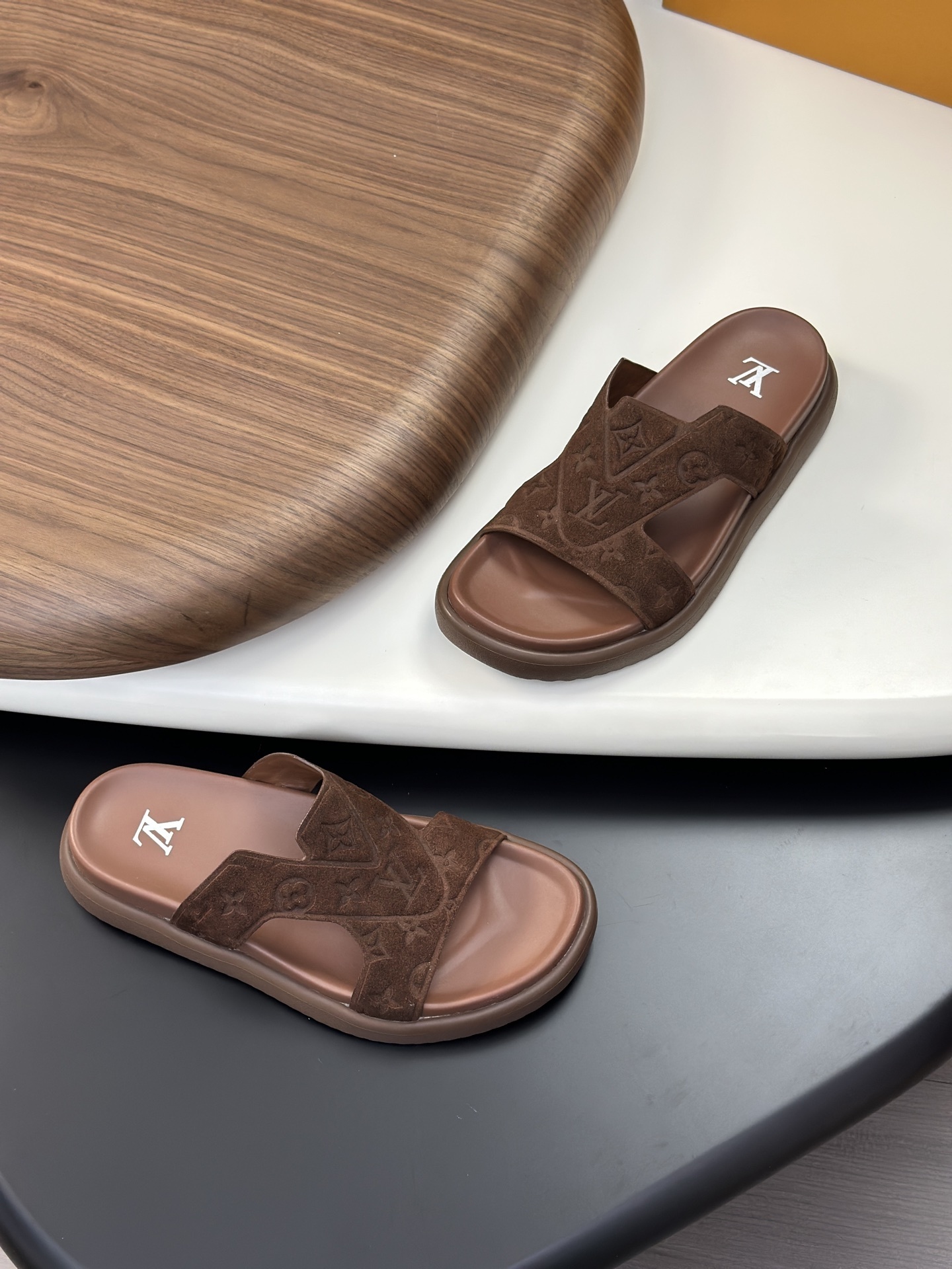 LV Oasis mule in Monogram-embossed brown suede calf leather.