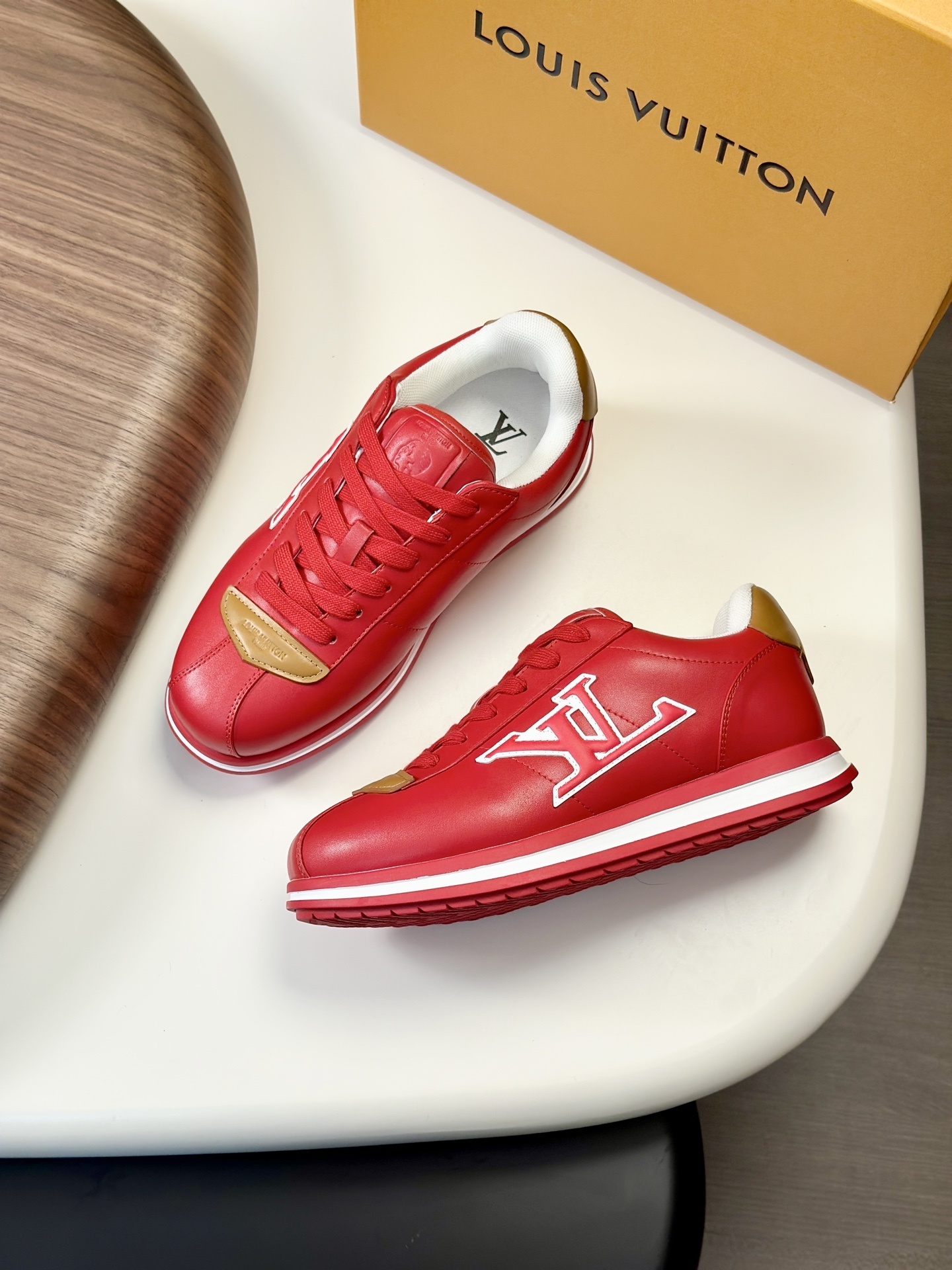 LV Buttersoft Sneakers in a red and tan colorway.