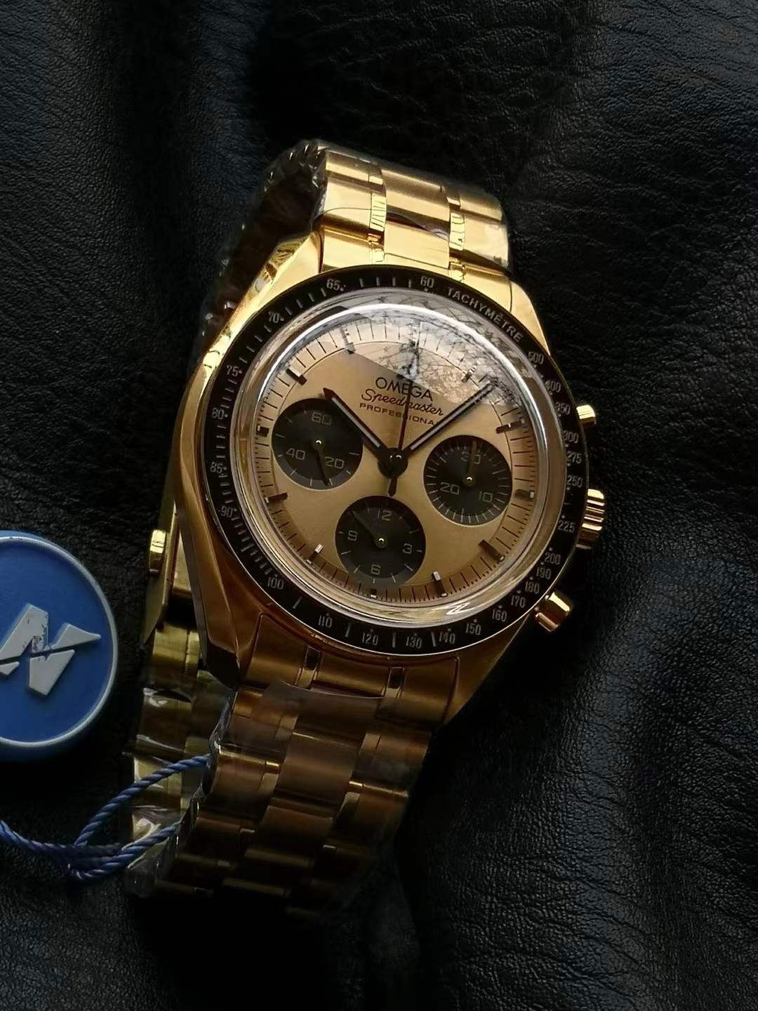 Omega Speedmaster Moonwatch Professional 42 mm chronograph in 18K Moonshine™ Gold with a matching bracelet and blackened subdials