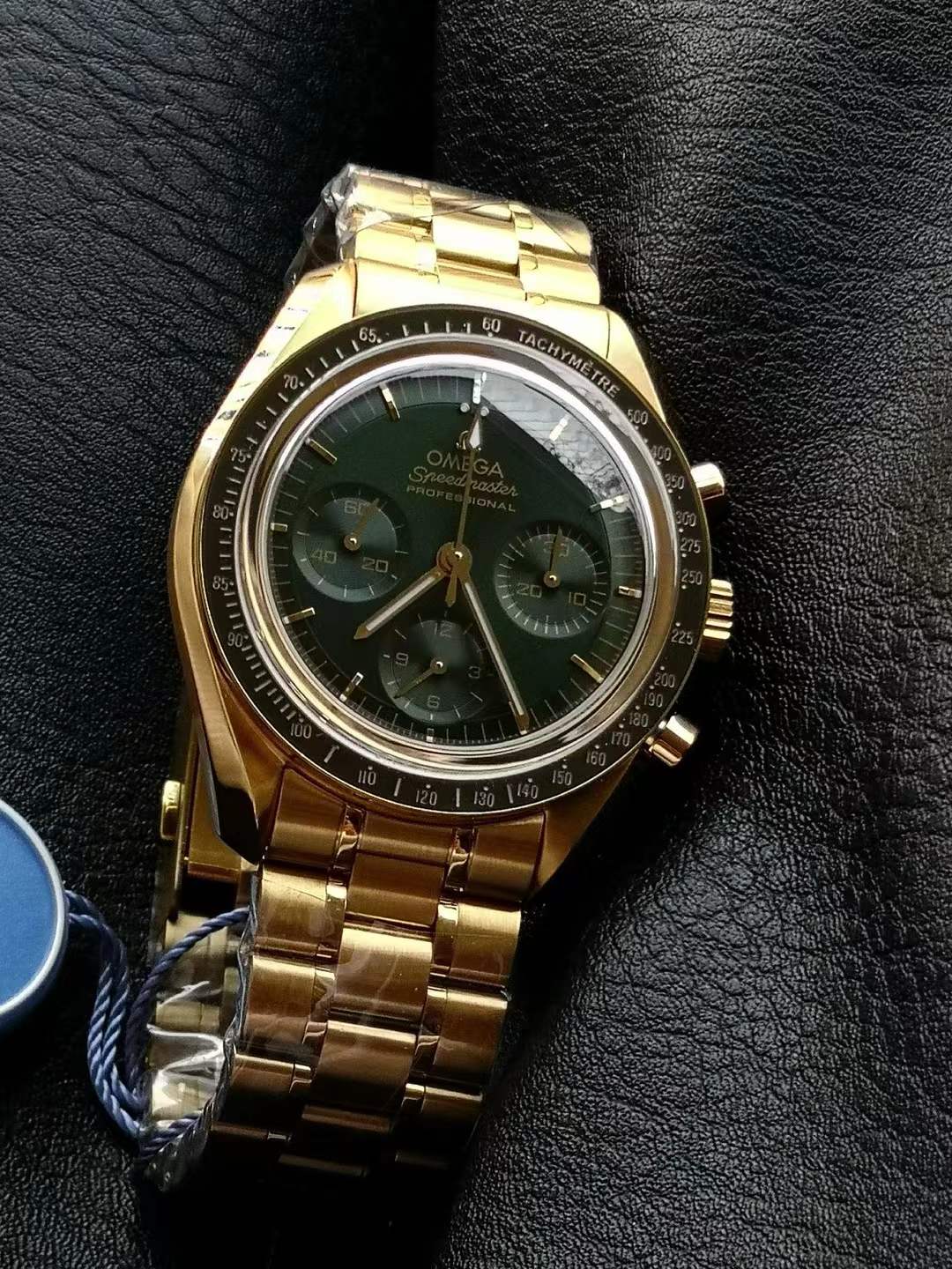 OMEGA Speedmaster Moonwatch Professional Co-Axial Master Chronometer Chronograph 42 mm in 18K Moonshine™ gold with a green dial and matching gold bracelet