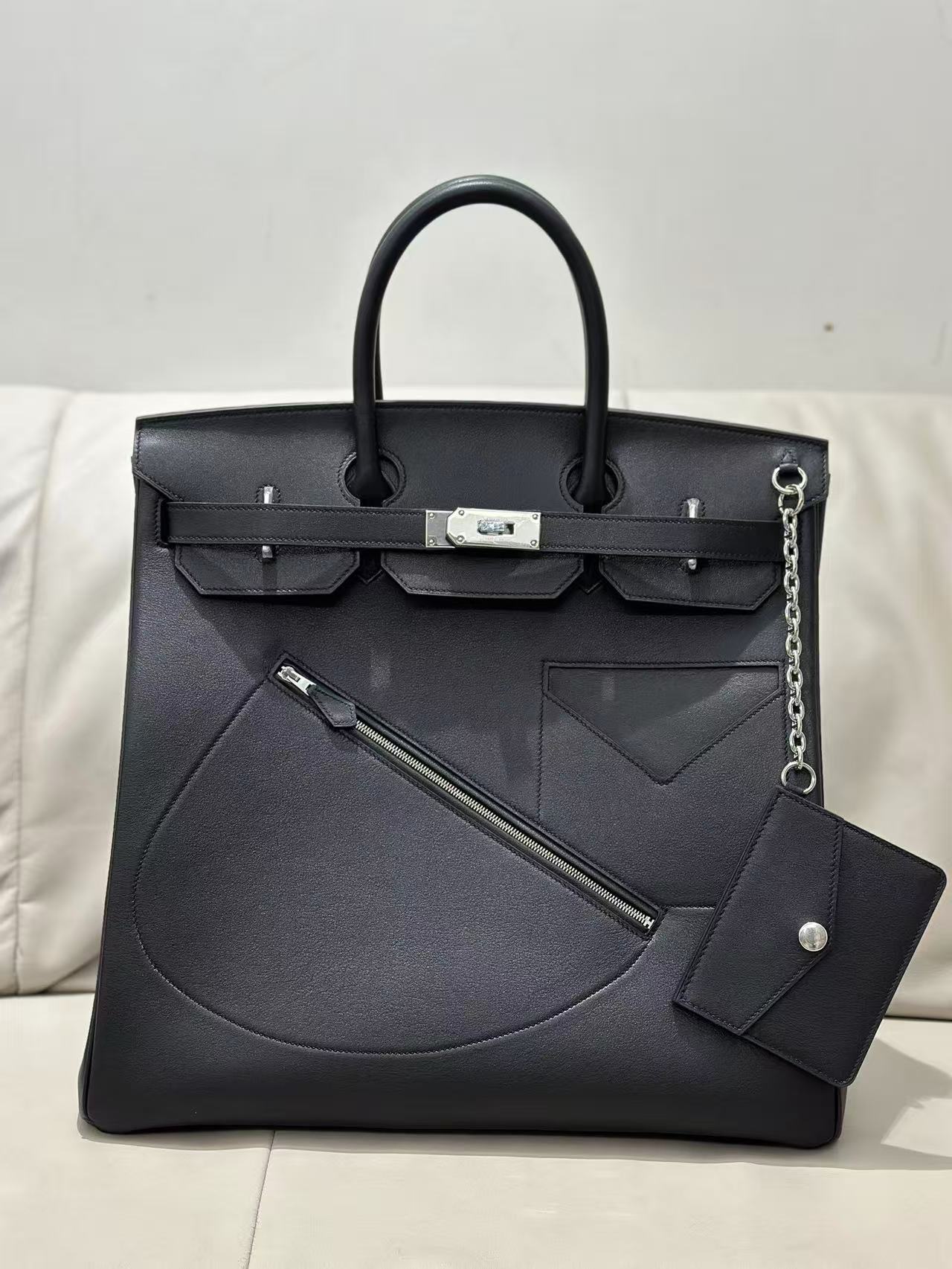 Hermès Haut à Courroies (HAC) bag black leather and multiple exterior pockets