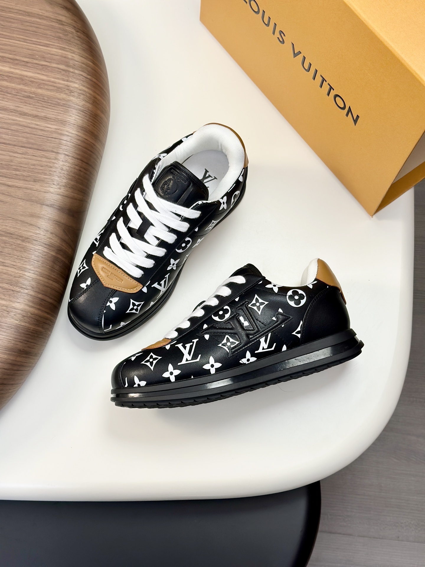 LV Buttersoft sneaker, in black leather with a white Monogram pattern and tan accents