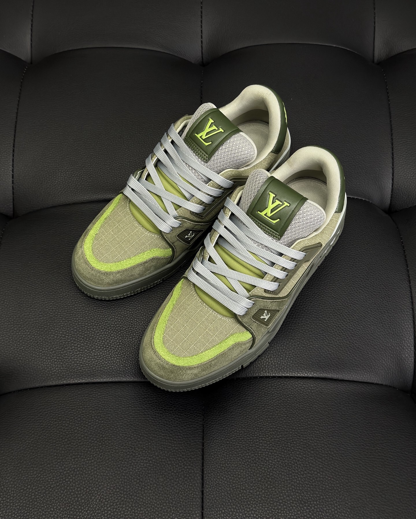 LV Trainer sneaker in a green and grey colorway, featuring Monogram denim and grained calf leather