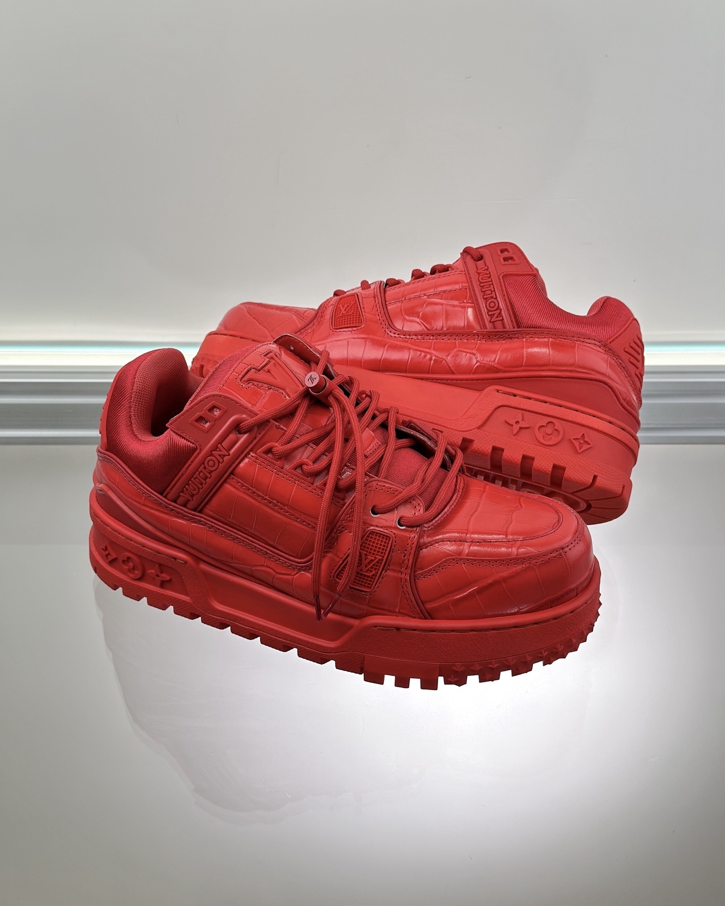 LV Trainer Maxi sneaker in red alligator-printed calf leather