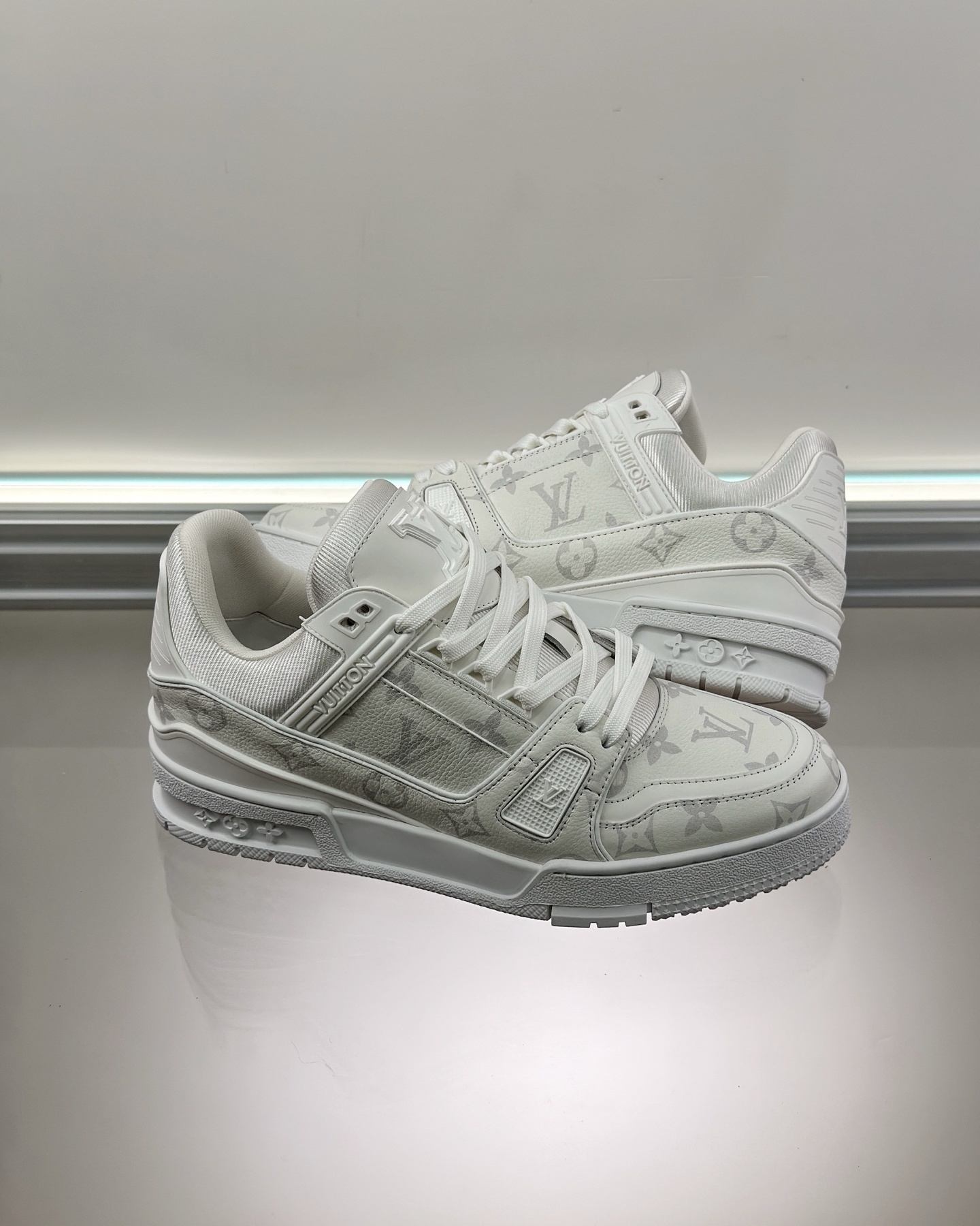 LV Trainer sneaker in white monogram-embossed grained calf leather