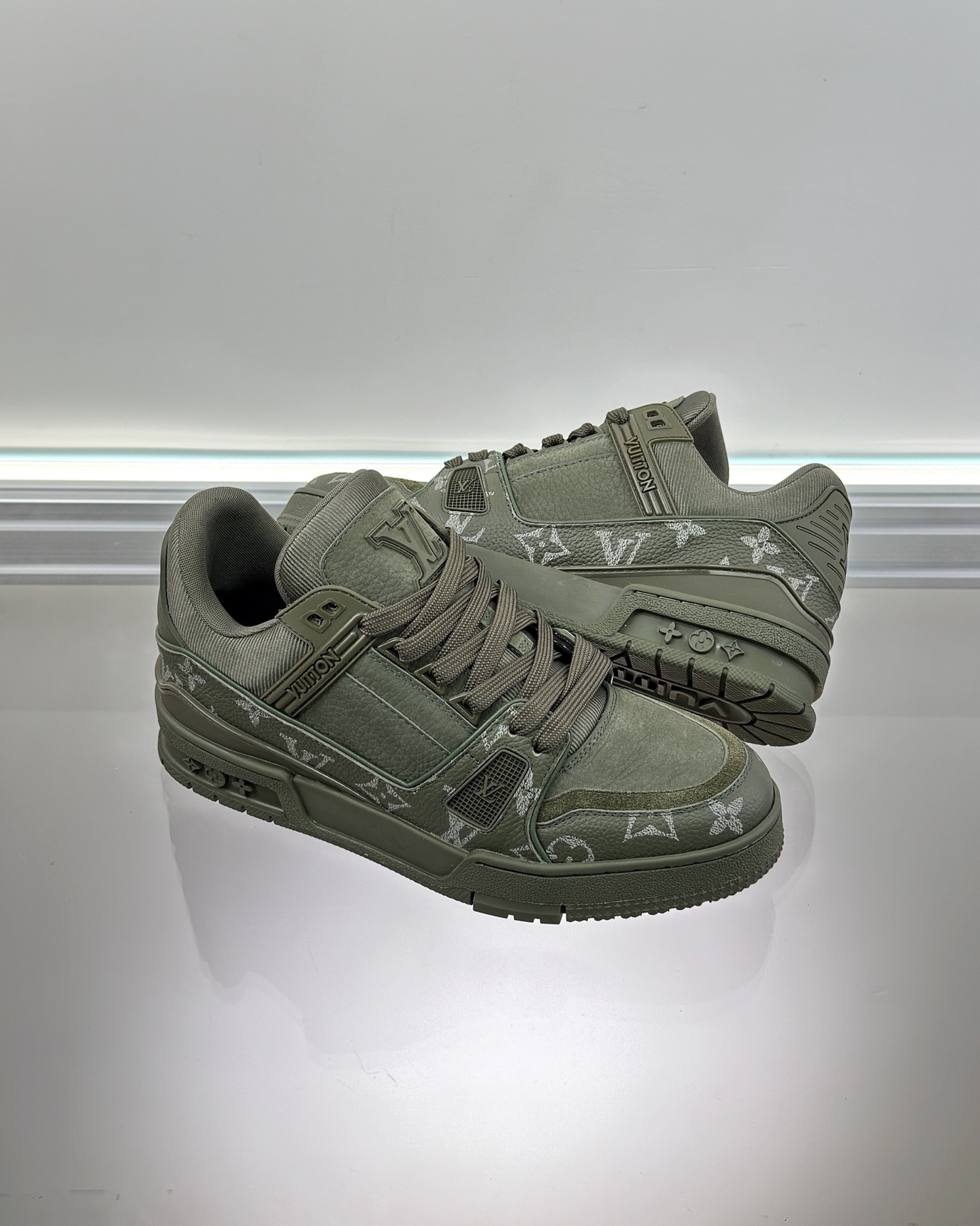 LV Trainer sneaker in Monogram-embossed grained calf leather and nubuck calf leather.