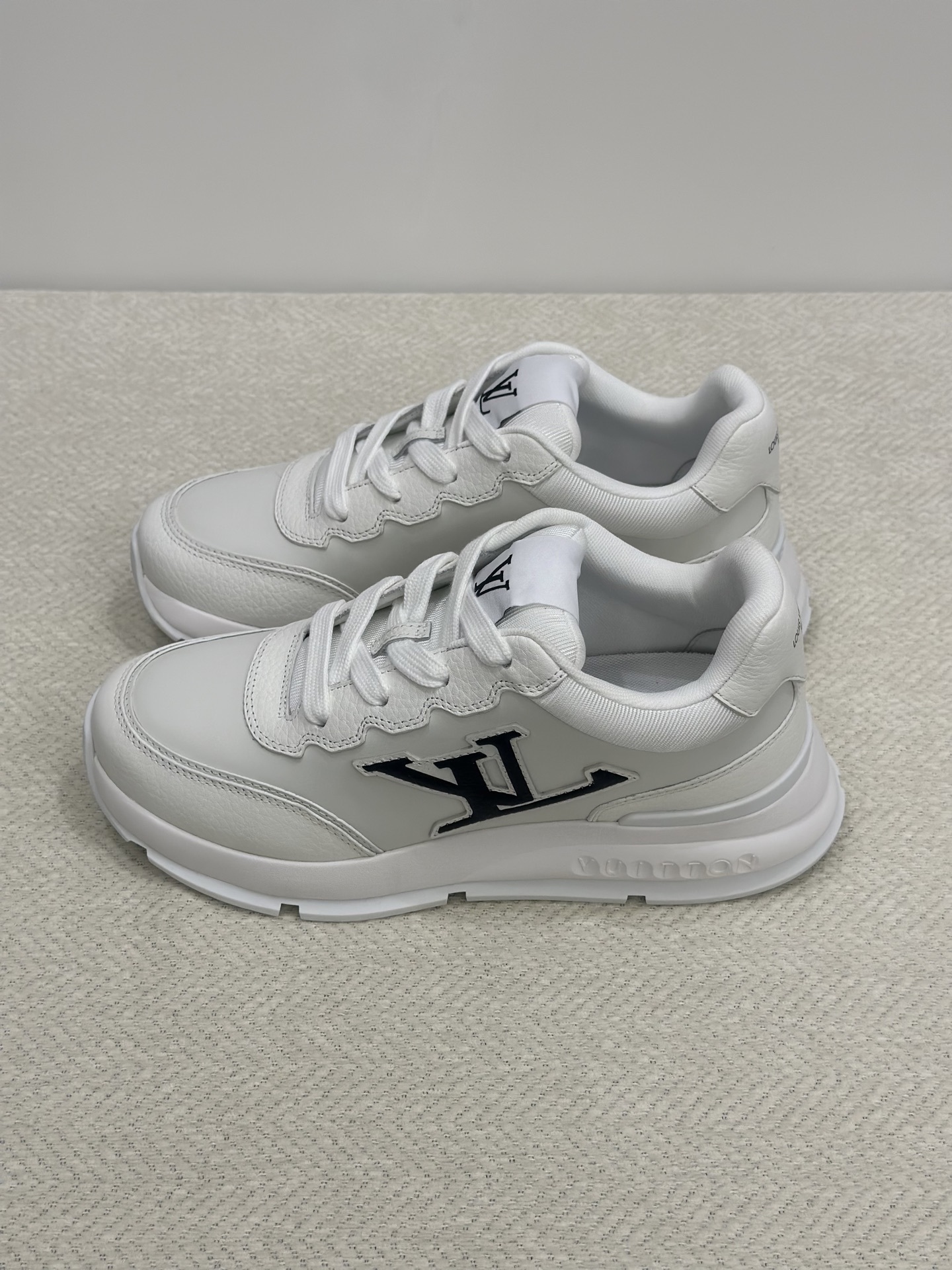 LV Classic Sneaker in white plain calf leather with a black LV logo