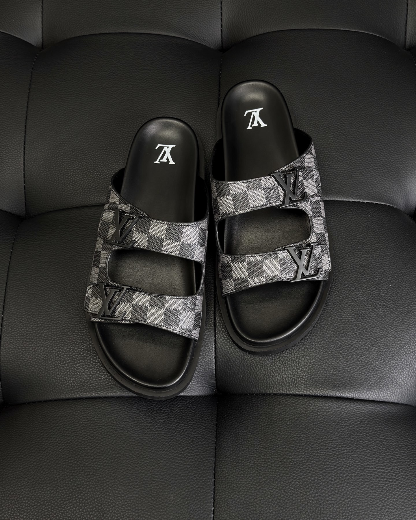 LV Miami mules in Damier-embossed synthetic leather.