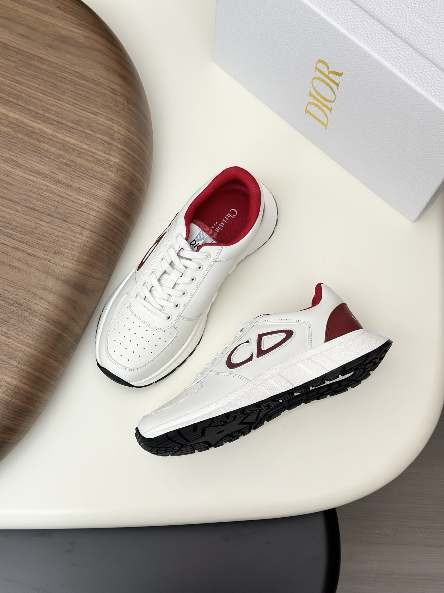 Dior B30 sneakers in white and burgundy with the "CD" logo on the side