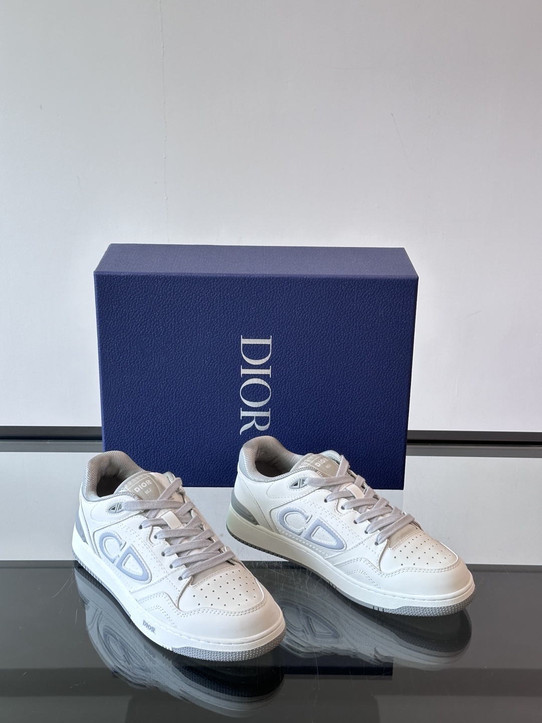 Dior B57 low-top sneaker in white and gray smooth calfskin with a light blue CD signature